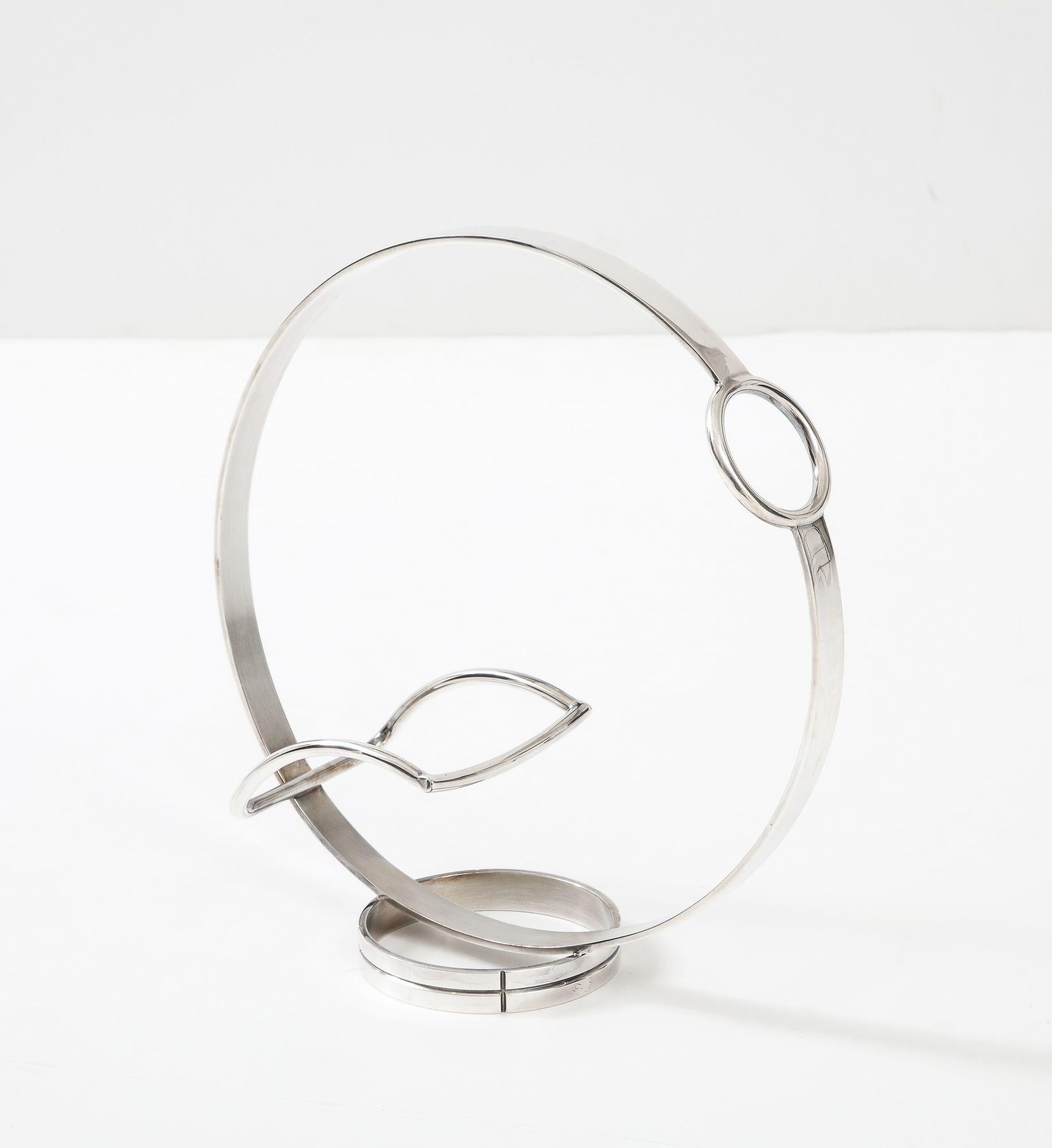 A stylish modern Christofle silver plated wine holder designed by Andre Putnam.
