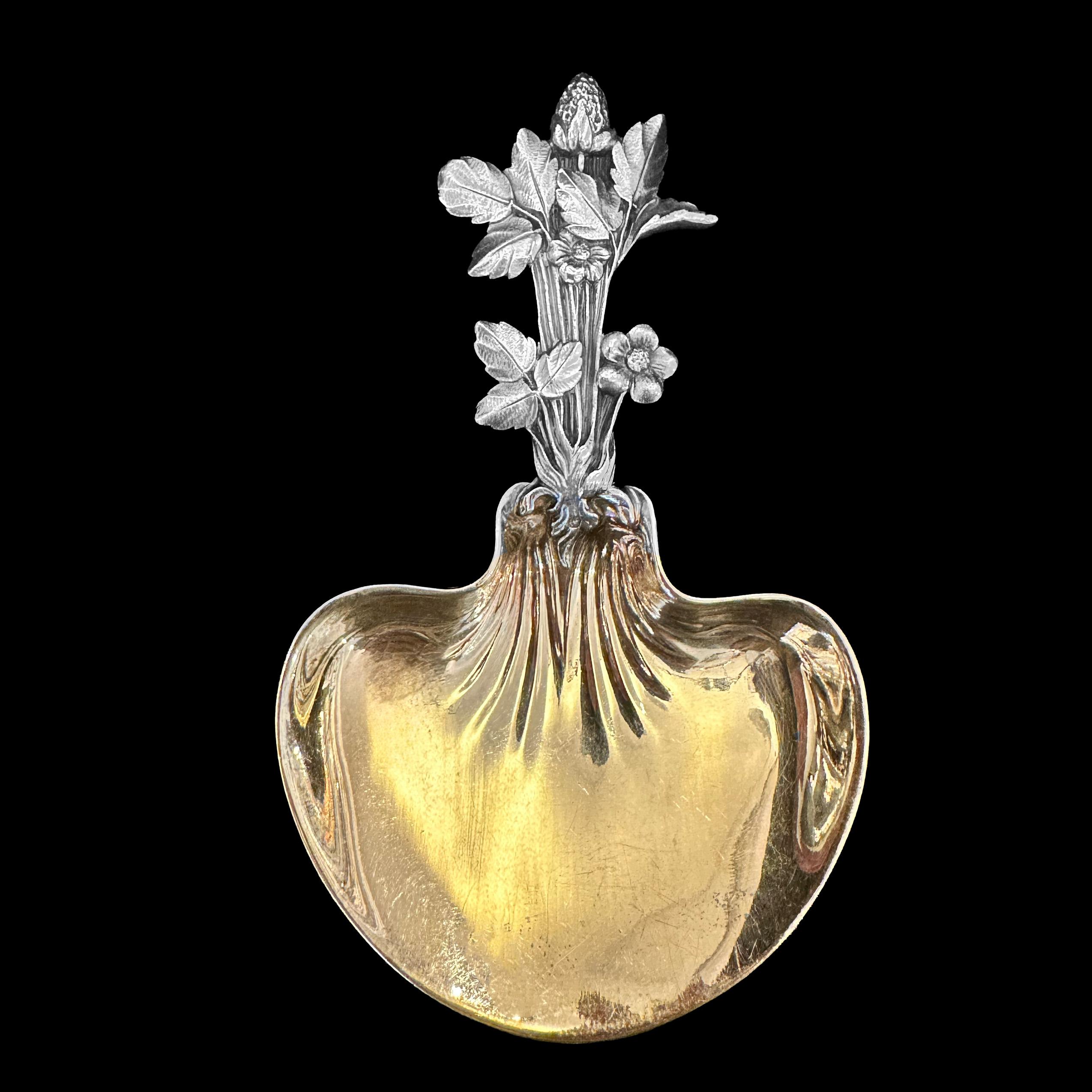 Add a touch of gourmet refinement with this exquisite and most sophisticated Christofle strawberry spoon set, comprising 12 dessert spoons and 2 large serving spoons, all crafted in fine solid silver with delicately gilt bowls. This set, inspired by