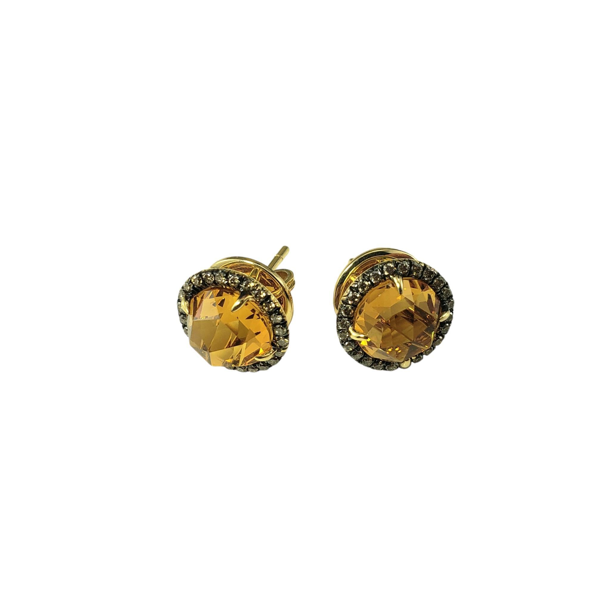 Christophe Danhier 18K Yellow Gold Citrine Quartz and Diamond Earrings-

These lovely stud earrings by jewelry designer Christophe Danhier each feature one faceted citrine quartz stone (7 mm) surrounded by 24 round brilliant cut diamonds.  Push back
