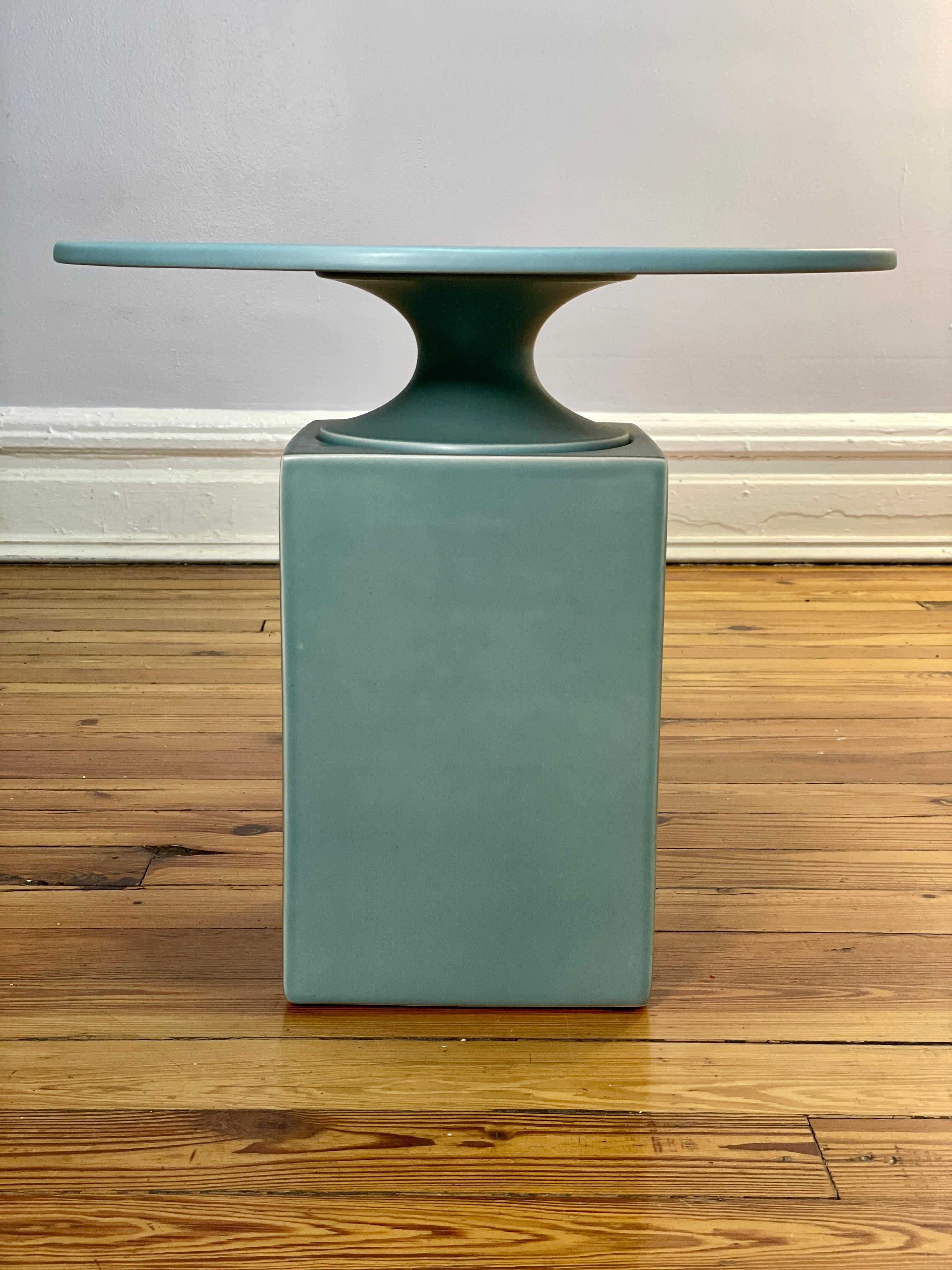 This contemporary side table is part of the Delcourt Collection. Edited by Christophe Delcourt and designed by Vincent Dupont-Rougier.  this OUK side table is in ceramic and beautifully glazed with a nice blue tone. Its design resembles a pedestal