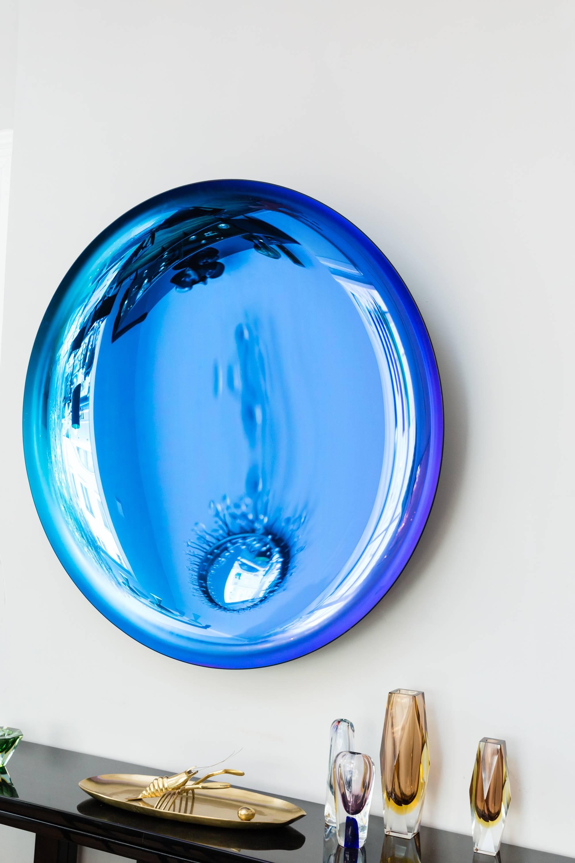 Amazing concave mirror object by Christophe Gaignon, blue and purple reflective glass, color gradient depending on the light irradiation, tinted glass bowl with heavy polished brass mount, the bracket is signed by the artist, France, 2017. Unique