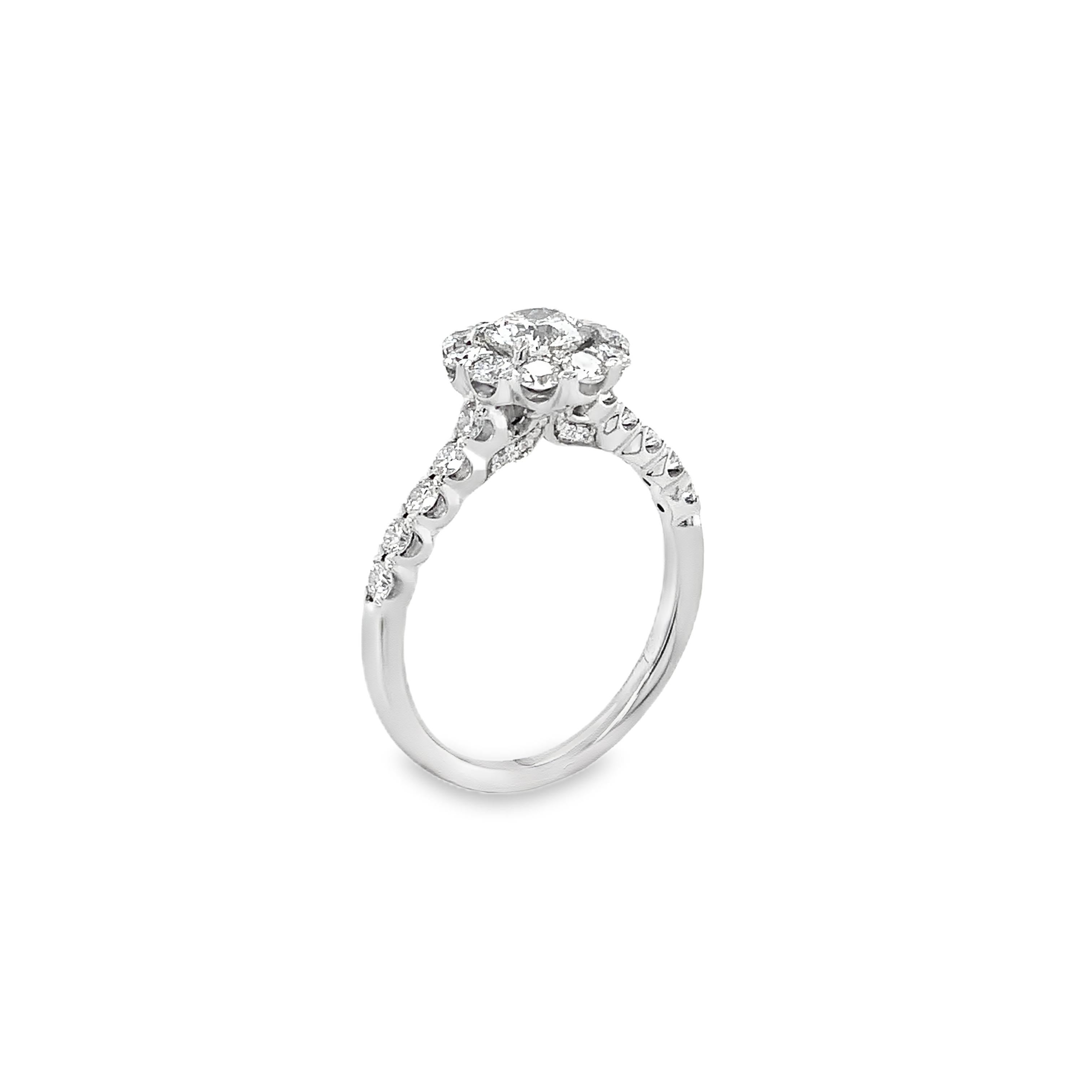 Boasting a magnificent design of 29 Round Brilliant Diamonds with a total carat weight of 0.75cts, the Christopher Designs Crisscut® Round Halo Diamond Engagement Ring in 18K White Gold also features a stunning modified brilliant Crisscut® in the
