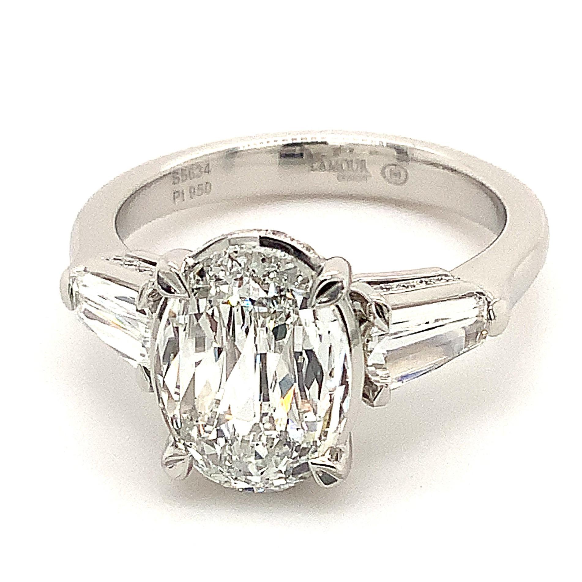  

The Christopher Designs L'Amour Crisscut® 2.01 ct Oval Classic Three Stone Diamond Ring Set in Platinum features a GIA Certified E Color SI 1 Clarity Oval Modified Brilliant Cut Center Stone of 10.26 x 7.63 x 3.13 mm,

laser inscribed L'Amour