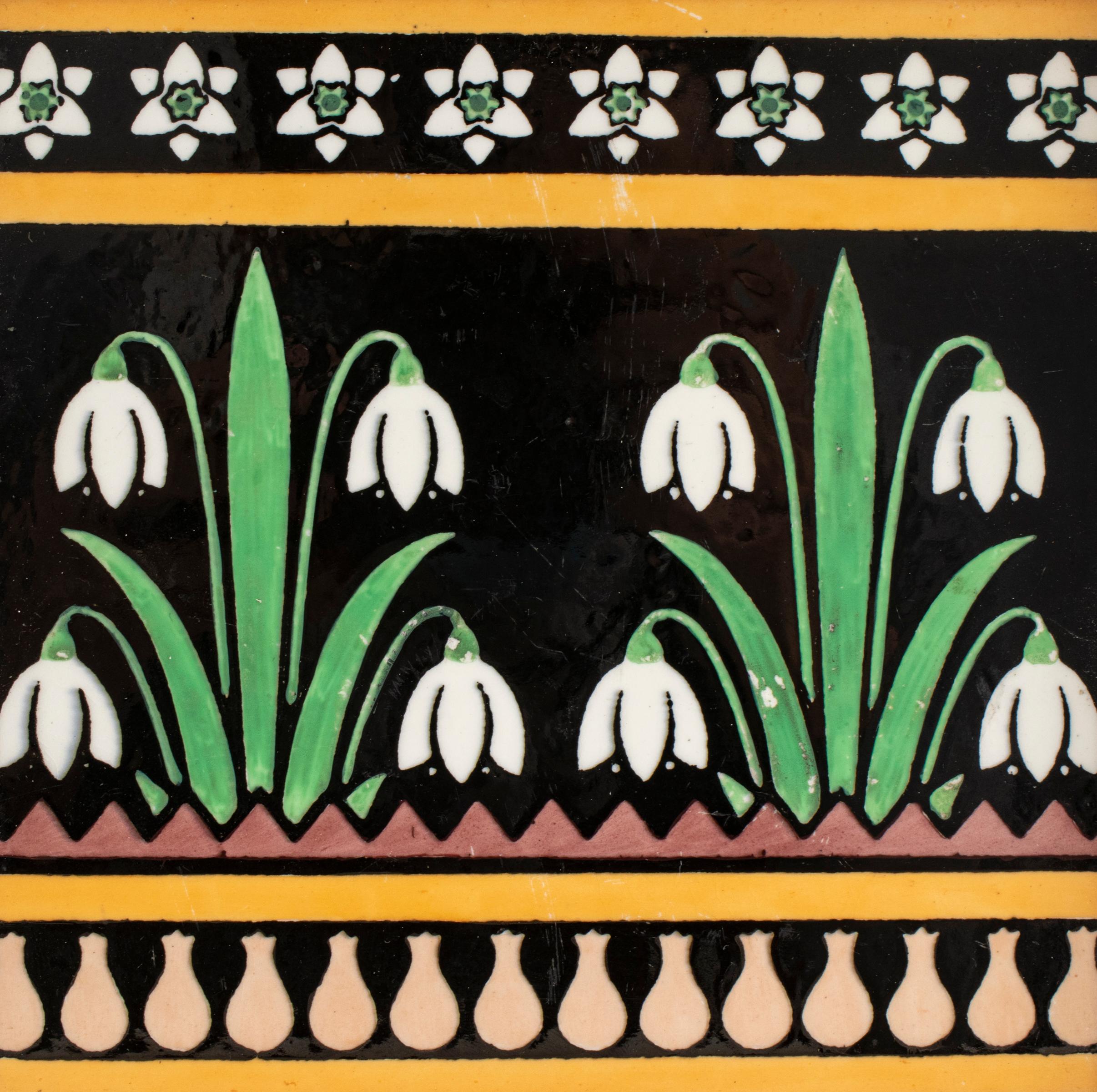English Arts & Crafts Minton pottery tile designed by Christopher Dresser, late 19th century, featuring Art Nouveau / Aesthetic Movement lily of the valley floral motif, the tile reverse with embossed stamped letter 