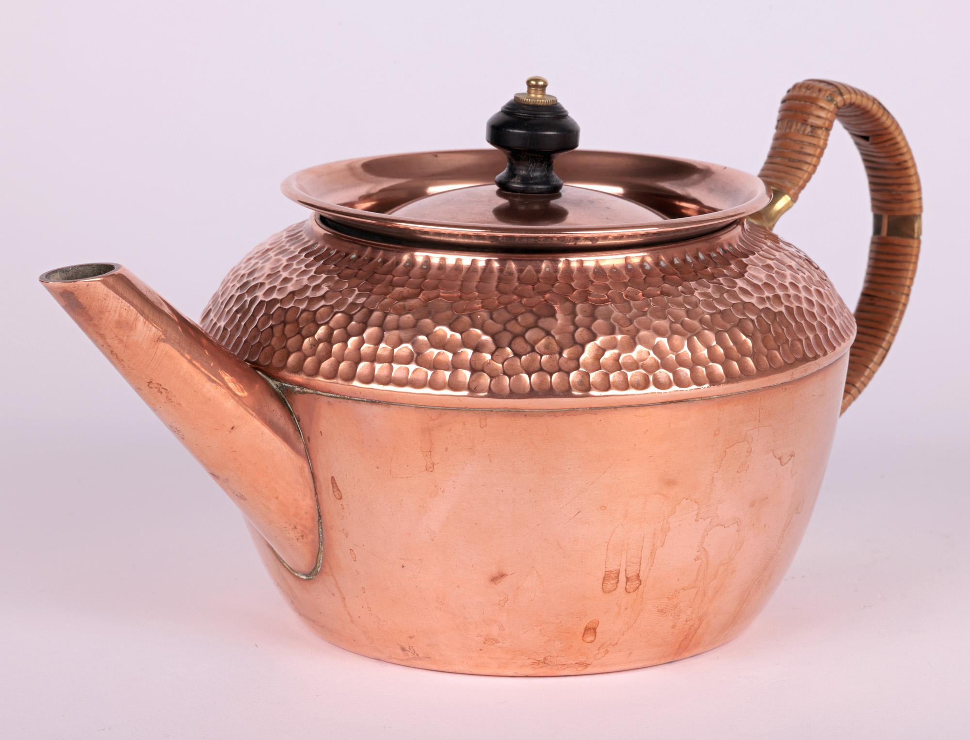 A rare aesthetic movement three piece copper and brass teaset designed by Christopher Dresser for Henry Loveridge & Co in 1881. The set comprises of a teapot, milk jug and sugar bowl each copper bodied with hand planished patterning to the shoulders
