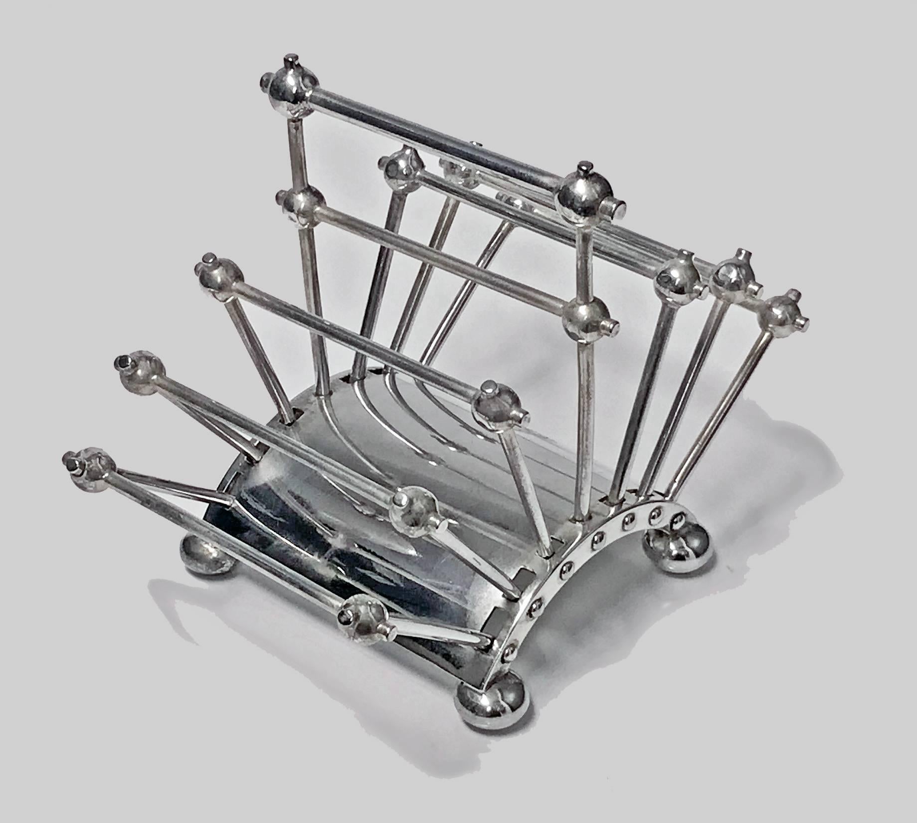 Christopher Dresser Hukin and Heath toast rack, 1881. The articulated silver plate six-section Toast or Letter rack designed by Christopher Dresser for Hukin and Heath with Registration Mark for 1881. The Toast Rack of hinged bar form on four bun