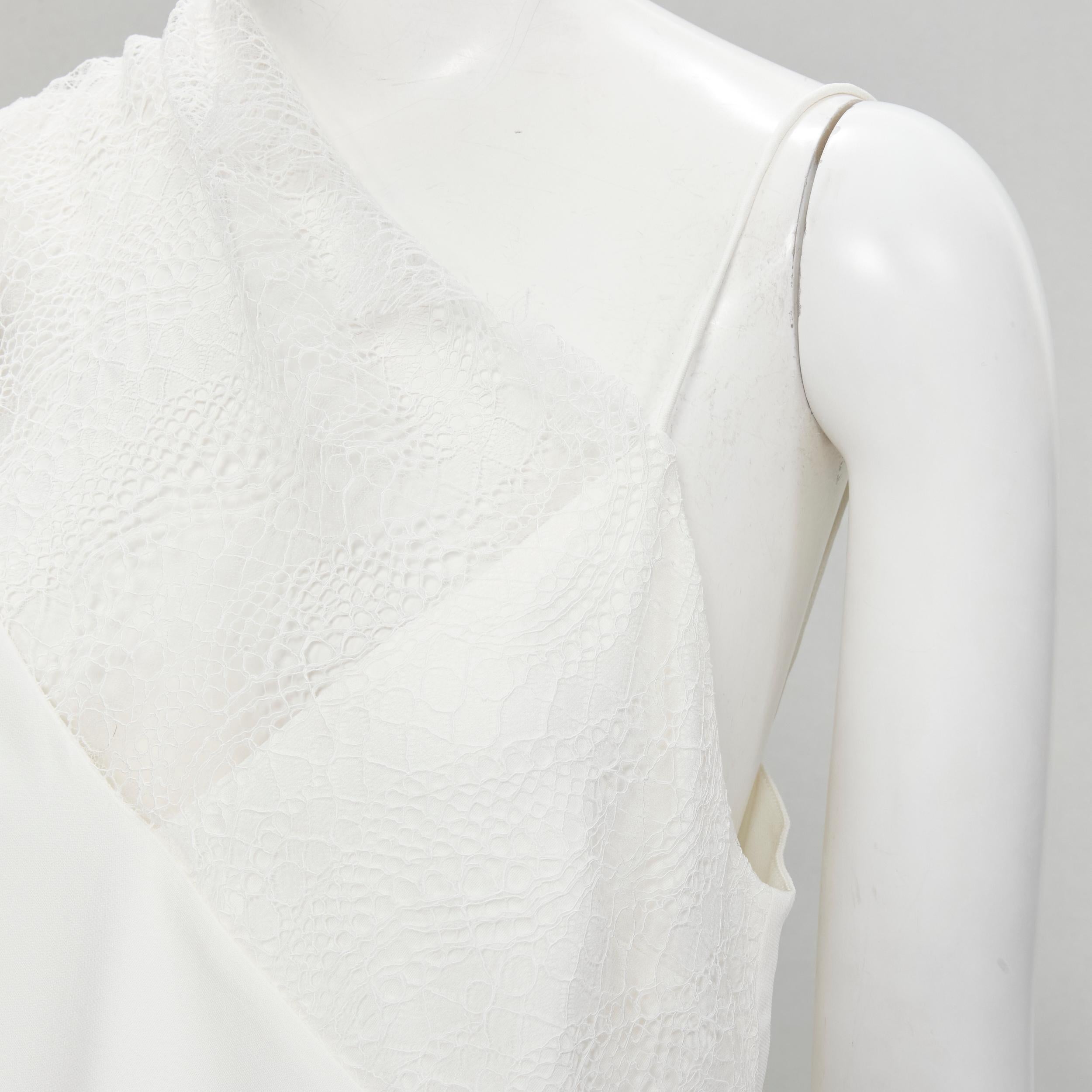 CHRISTOPHER ESBER white asymmetric lace trim camisole slip top UK10 M
Brand: Christopher Esber
Extra Detail: Designed to look like a regular spaghetti cami with asymmetric lace trim

CONDITION:
Condition: Excellent, this item was pre-owned and is in