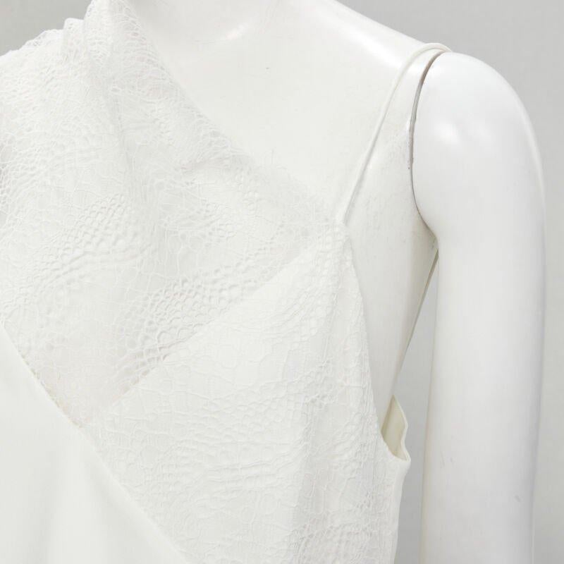 CHRISTOPHER ESBER white asymmetric lace trim camisole slip top UK10 M
Reference: KNLM/A00210
Brand: Christopher Esber
Material: Viscose, Lycra
Color: White
Pattern: Solid
Extra Details: Designed to look like a regular spaghetti cami with asymmetric