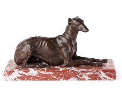 A large late 19th century French animalier bronze of a recumbent greyhound dog 