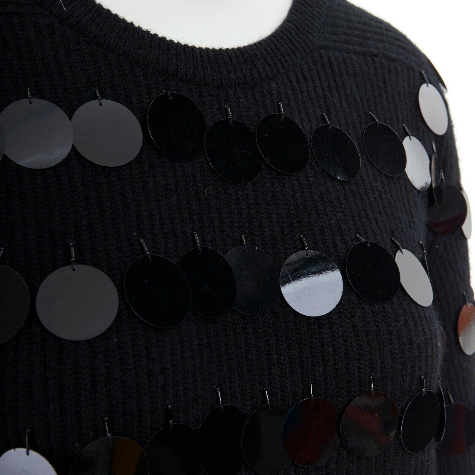CHRISTOPHER KANE 100% cashmere black bead pailette side slit knit sweater top S
CHRISTOPHER KANE
FROM THE FALL WINTER 2008 RUNWAY
100% cashmere. Round ribbed neck. 
Large pailette embellishment throughout. 
Long sleeves. Dual slit side. 
Made in