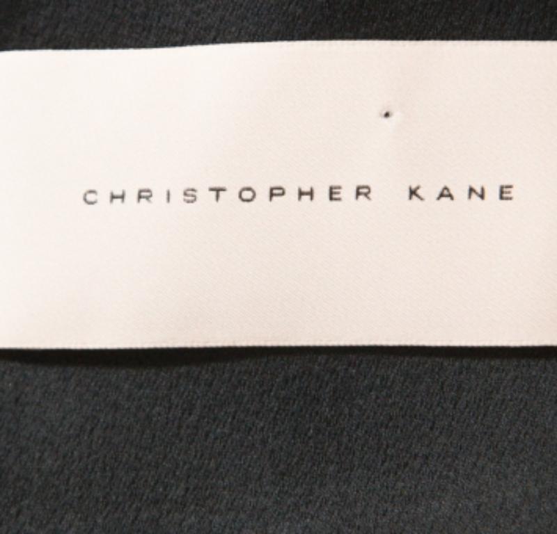 Design and quality come together in this top from Christopher Kane. This grand black top makes a modest statement and exudes a feminine vibe with floral appliques on the hem. This beautiful sleeveless top is made from carefully chosen blended fabric.