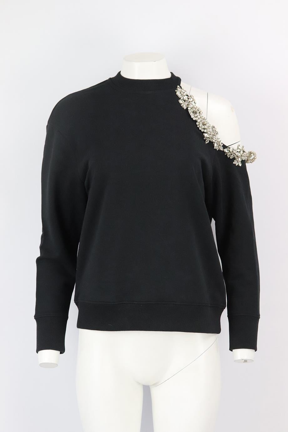 Christopher Kane cutout embellished cotton jersey sweatshirt. Black. Long sleeve, crewneck. Slips on. 100% Cotton; details1: 100% glass; details2: metal fiber. Size: XSmall (UK 6, US 2, FR 34, IT 38). Bust: 42 in. Waist: 41 in. Hips: 38 in. Length: