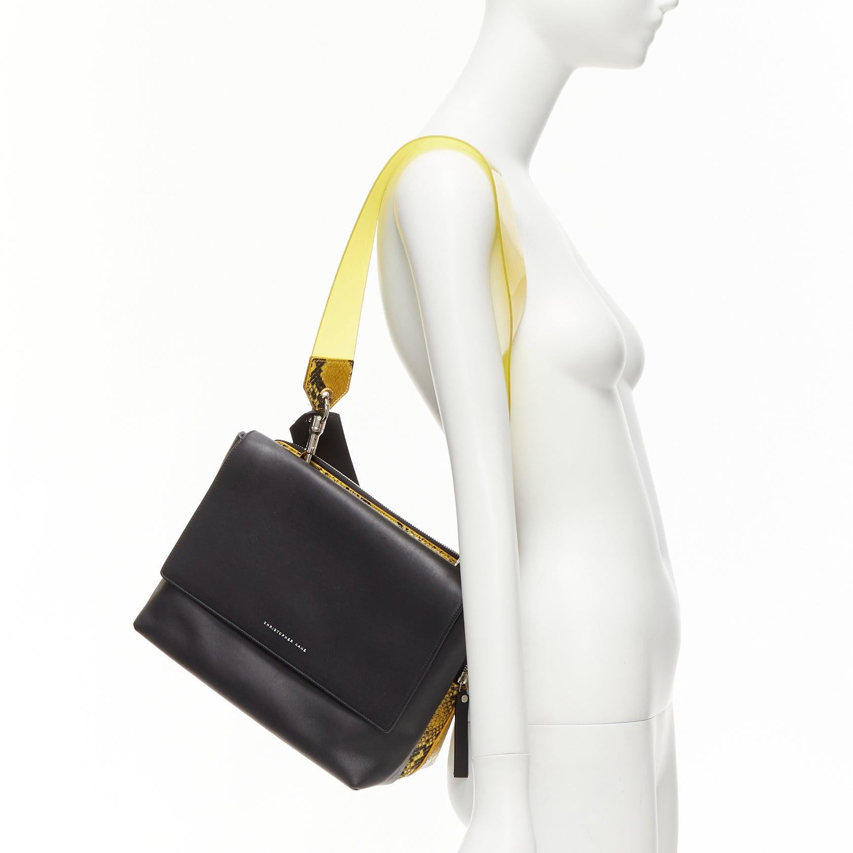 CHRISTOPHER KANE Dual black yellow scaled leather plastic strap reversible bag
Reference: NKLL/A00238
Brand: Christopher Kane
Model: Dual
Material: Leather, Metal
Color: Black, Yellow
Pattern: Animal Print
Closure: Snap Buttons
Lining: Black