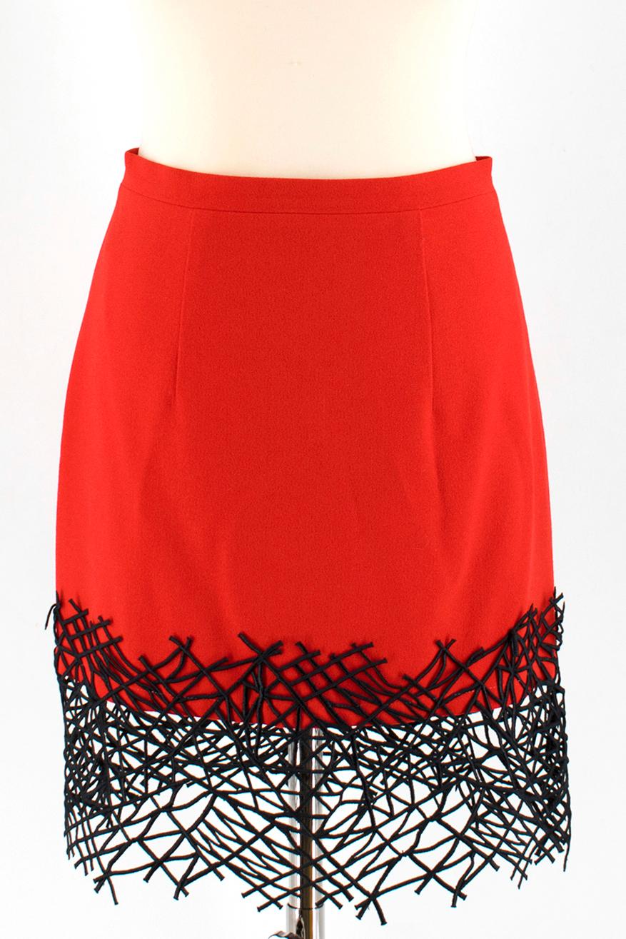 Christopher Kane Red Wool Embellished Top & Skirt

Top:
- red wool top
- sleeveless
- v- neckline
- wrap style
- large embellished button fastening to the front 

Skirt:
- red wool skirt
- mini length
- lined
- zip fastening to the back
- black