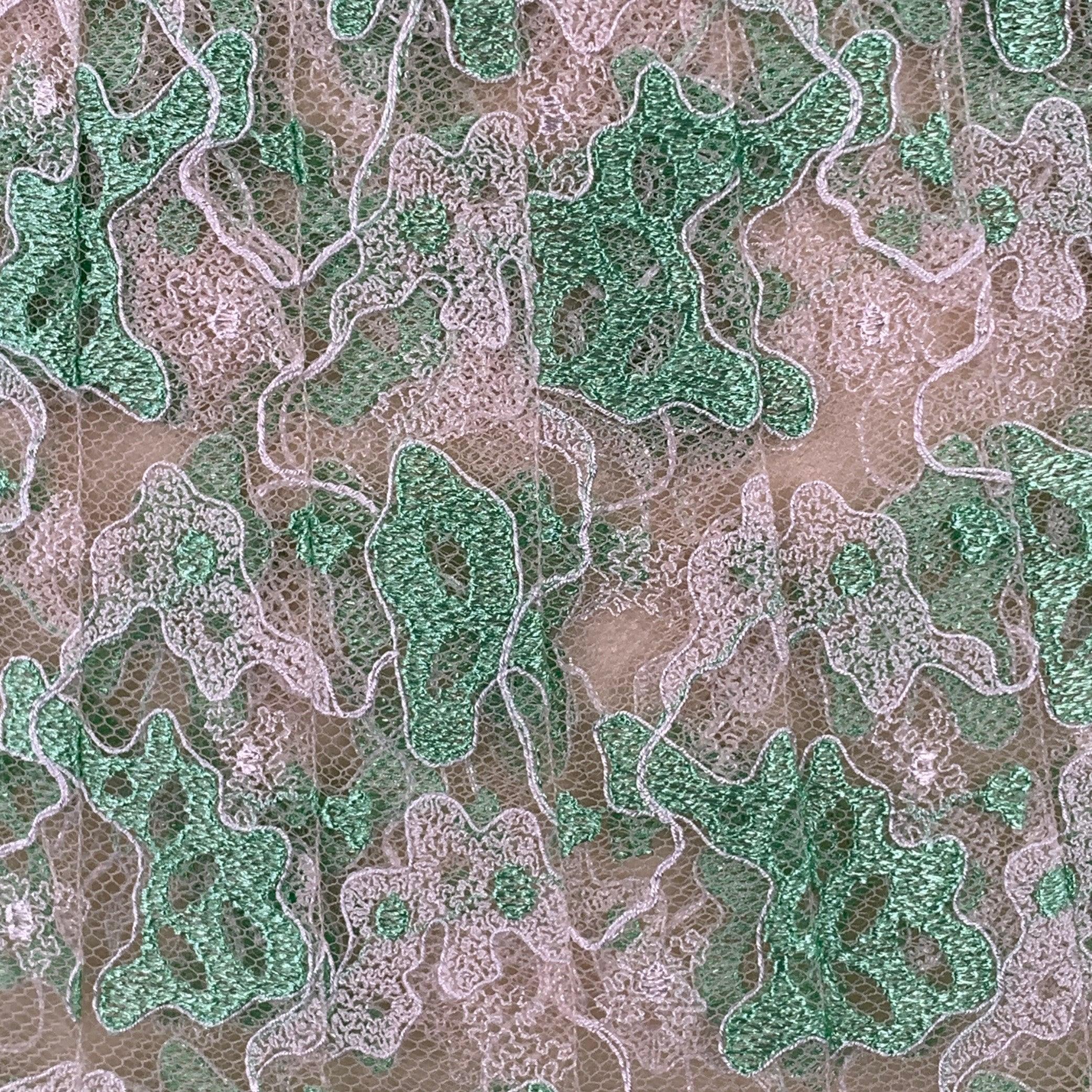 CHRISTOPER KANE skirt
in a green and cream silk lace featuring an organic blob pattern, pleated style, and side zipper closure. Made in France.Excellent Pre-Owned Condition. 

Marked:   EU 38 

Measurements: 
  Waist: 26 inches Hip: 34 inches