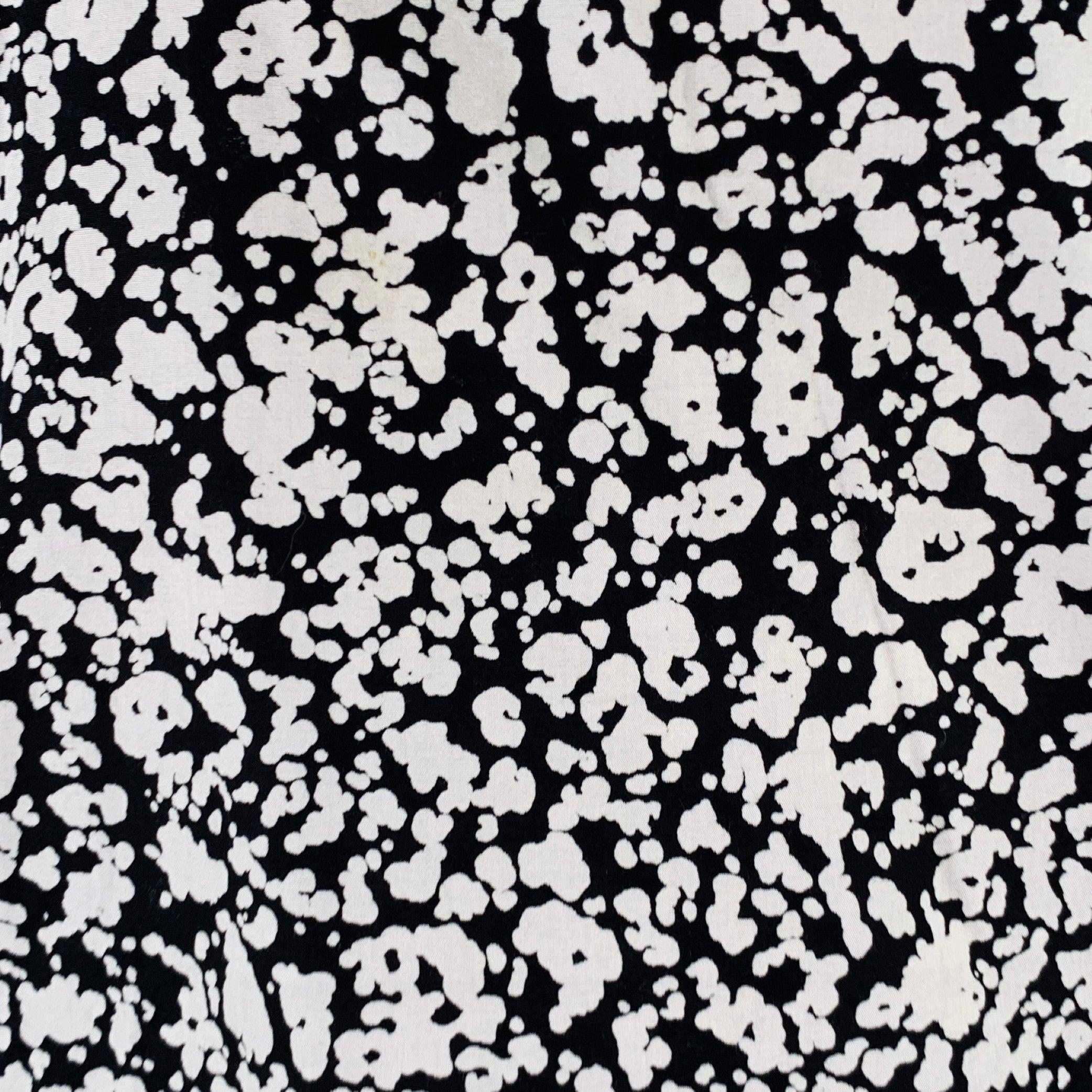 CHRISTOPHER KANE short sleeve shirt comes in a black & white paint splattered cotton featuring a half button closure. Made in Italy.Excellent Pre-Owned Condition. 

Marked:   XXL 

Measurements: 
 
Shoulder: 19.5 inches Chest: 46 inches Sleeve: 10.5
