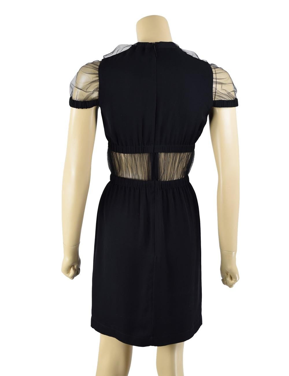 Christopher Kane black silk and net panel mini dress. Elastic sleeve trim and wait. Hidden back zipper

Additional information:
Material: Silk & Mesh
Features: mesh detailing on sleeves and around waist area, back zipper
Size: US 6 / EU 36
Overall