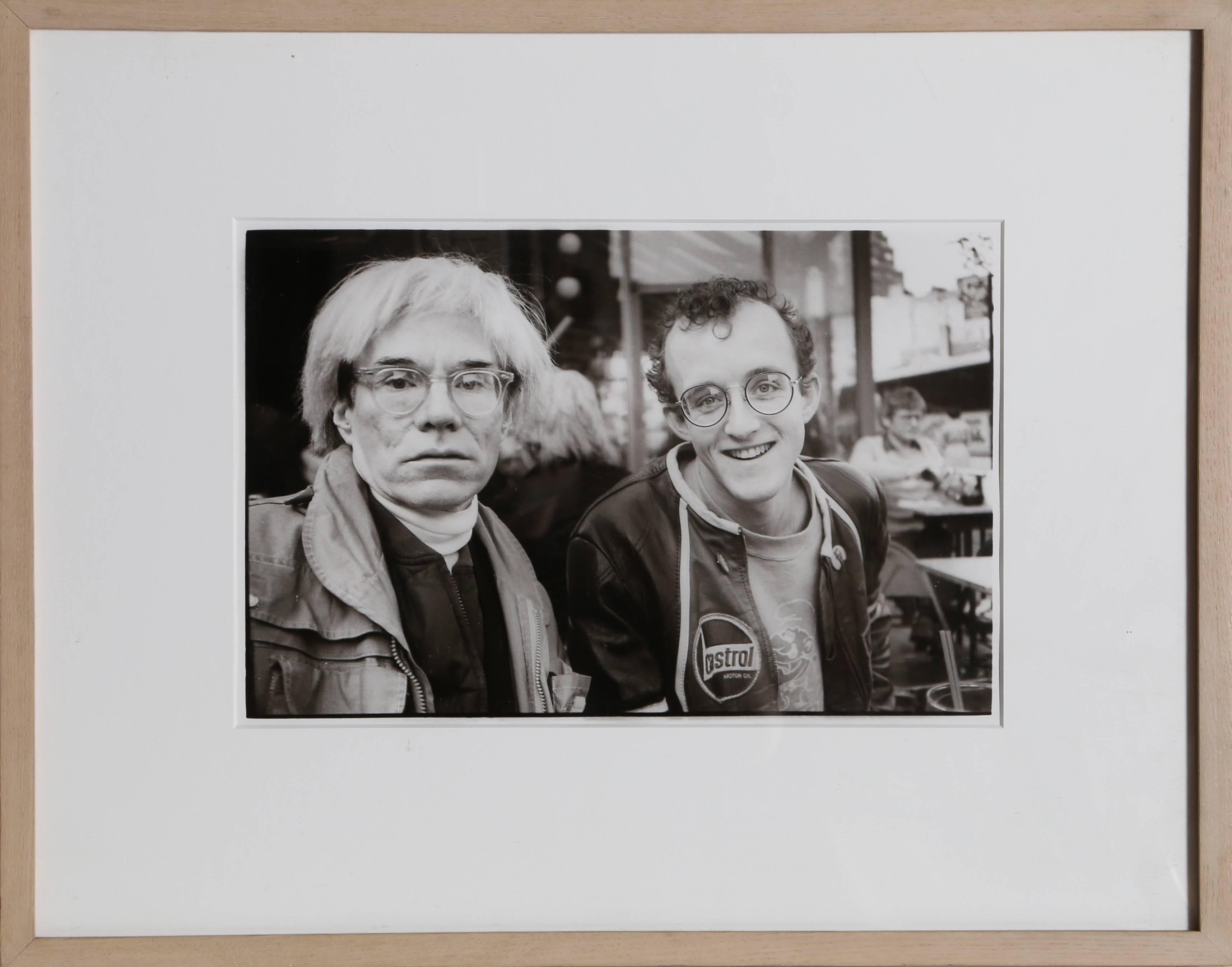 Artist: Christopher Makos, American (1948 - )
Title:	Andy Warhol and Keith Haring
Year:	1983
Medium:	Gelatin Silver Print Photograph, signed, stamped and numbered verso
Edition: 1/5
Image Size:	8 x 11 inches
Size: 11 x 14 inches
Frame: 15 x 18.75