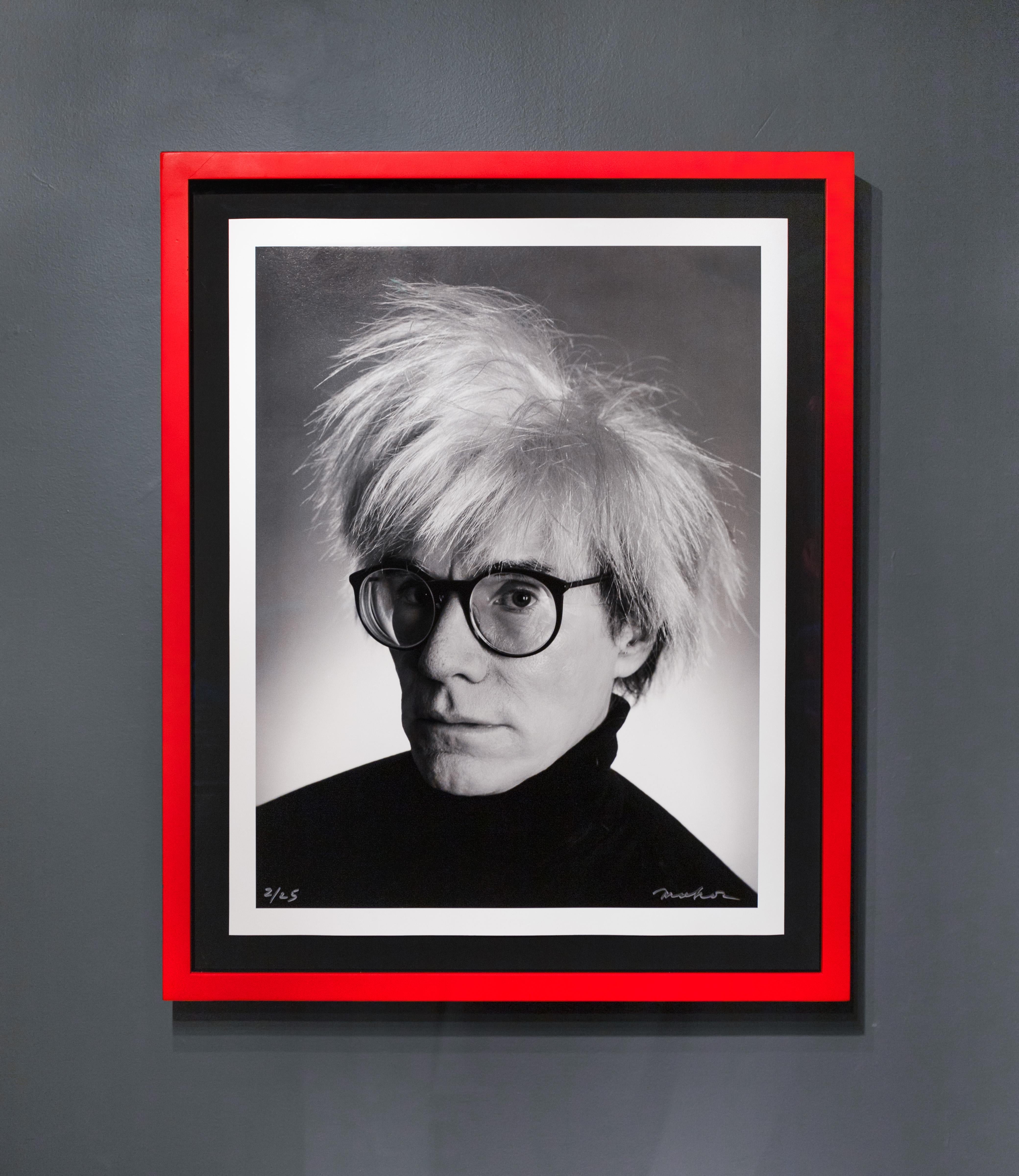 The ‘Archival Andy Warhol Portrait,’ taken by Christopher Makos, is a nostalgic photograph of the beloved pop-art icon, and Makos’ dear friend, Andy Warhol. The two artists had a wonderful friendship and shared many adventures together, as they