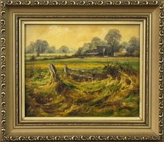 Granja en la campiña inglesa con cálidos colores marrón dorado y verde exuberante