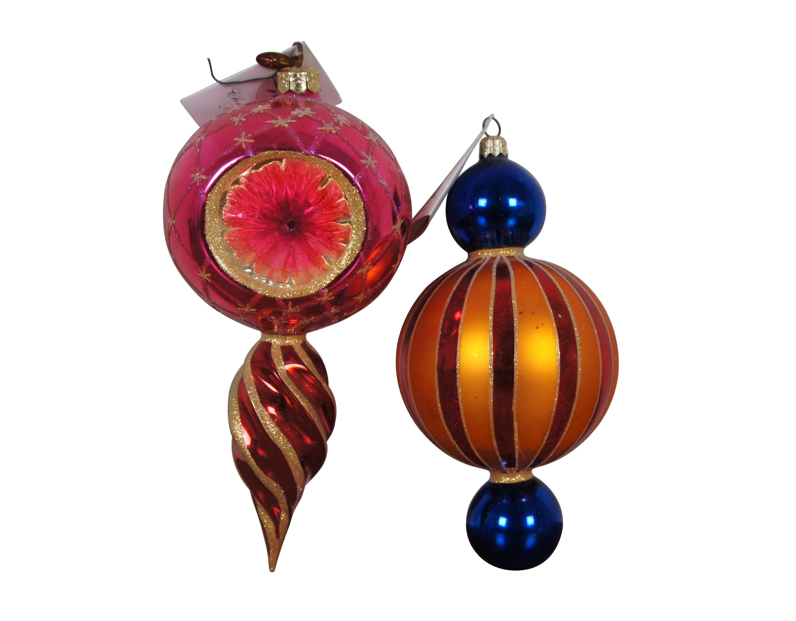 Vintage late 20th century Christopher Radko and Waterford hand painted, blown glass Christmas / holiday ornaments.  Christopher Radkos feature - red, orange and blue Bright Circus Stripes (99-346-0) and pink and gold Star Reflection (00-343-0).