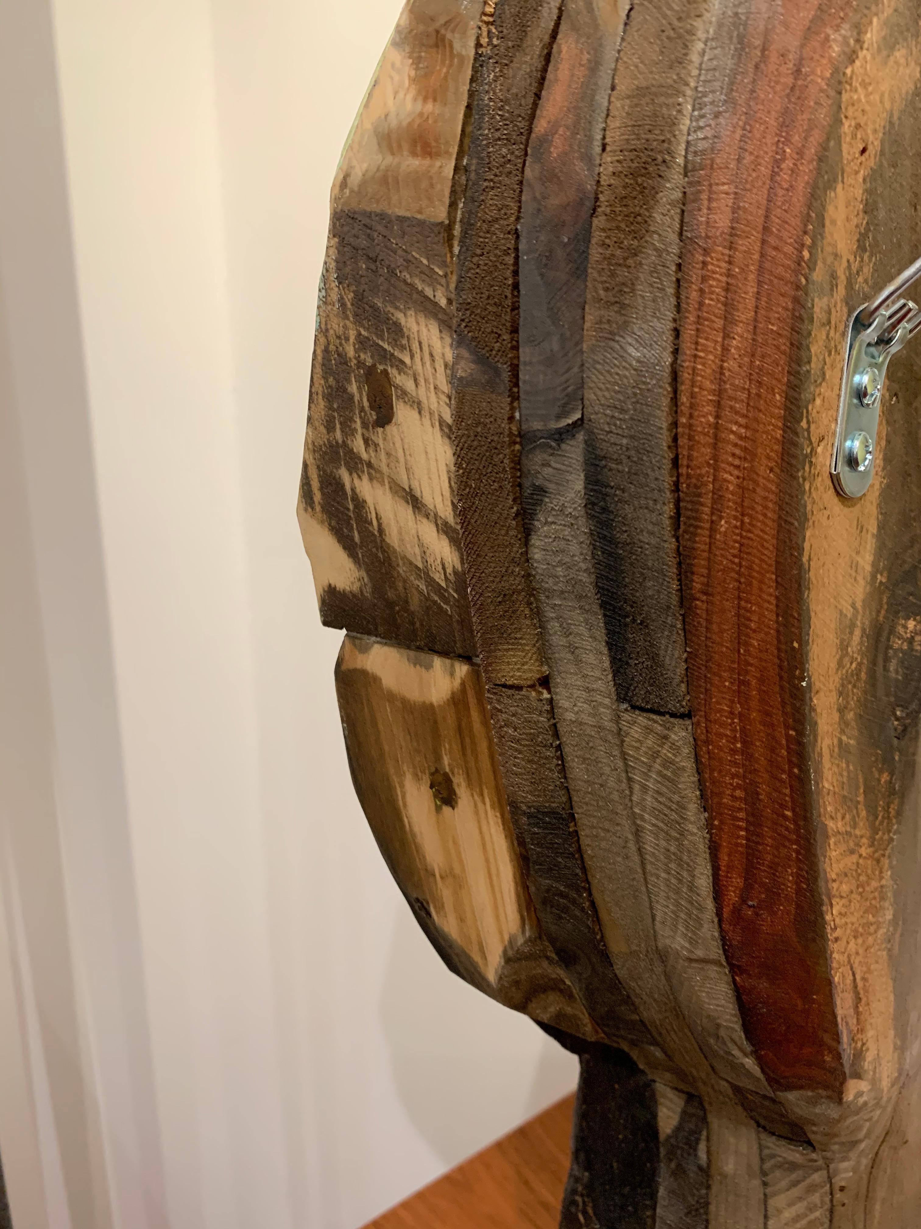 Leaning, a wood sculpture by artist Chris Reilly. This piece may be displayed atop a surface or hanging on the wall. 

Chris Reilly has made a career of painting beautiful nature scenes in encaustic. He was born in New York and has called San Diego