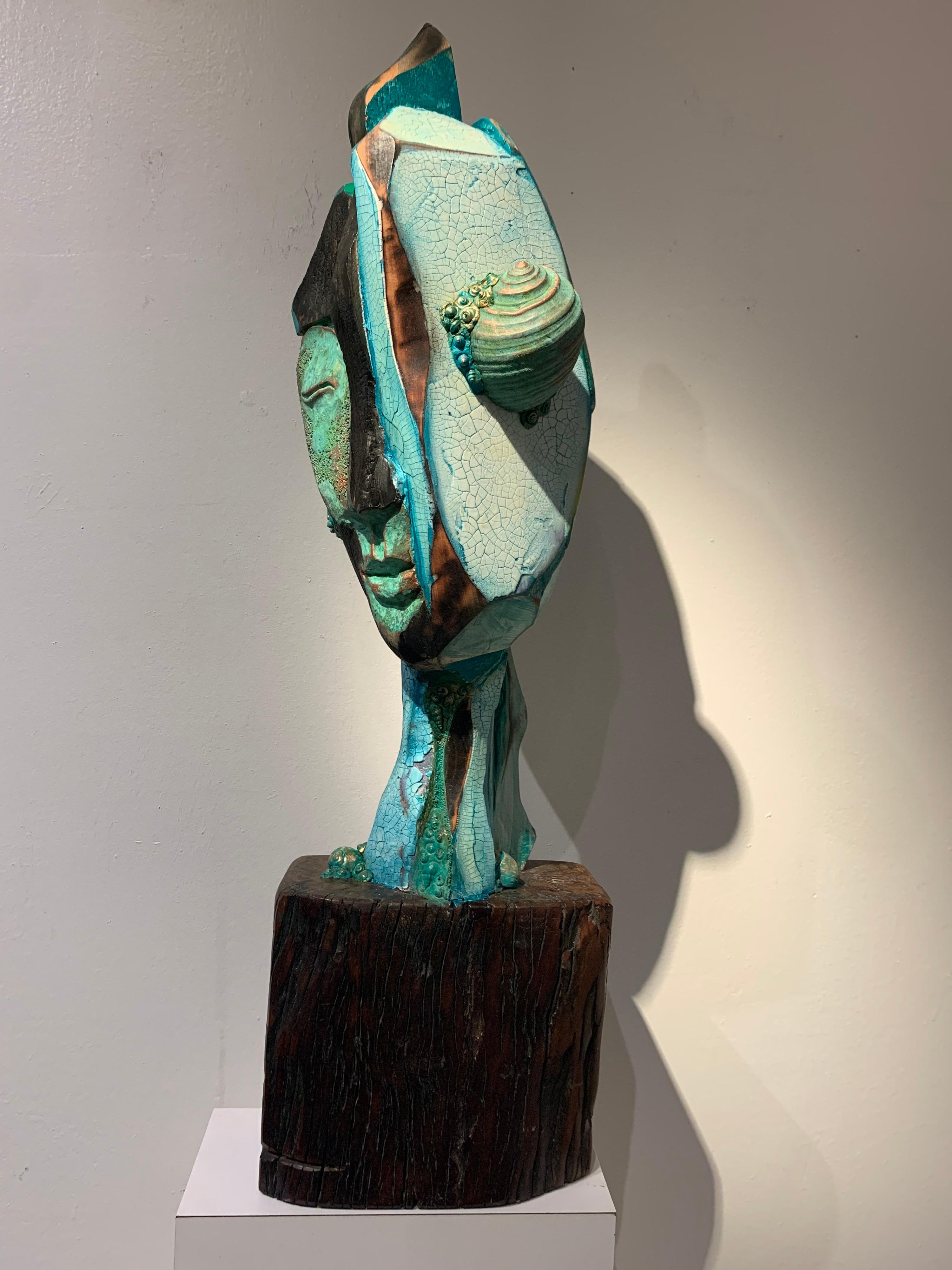 Chris Reilly Figurative Sculpture - Listening, wood, acrylic, mixed media sculpture, green, blue, off white, brown