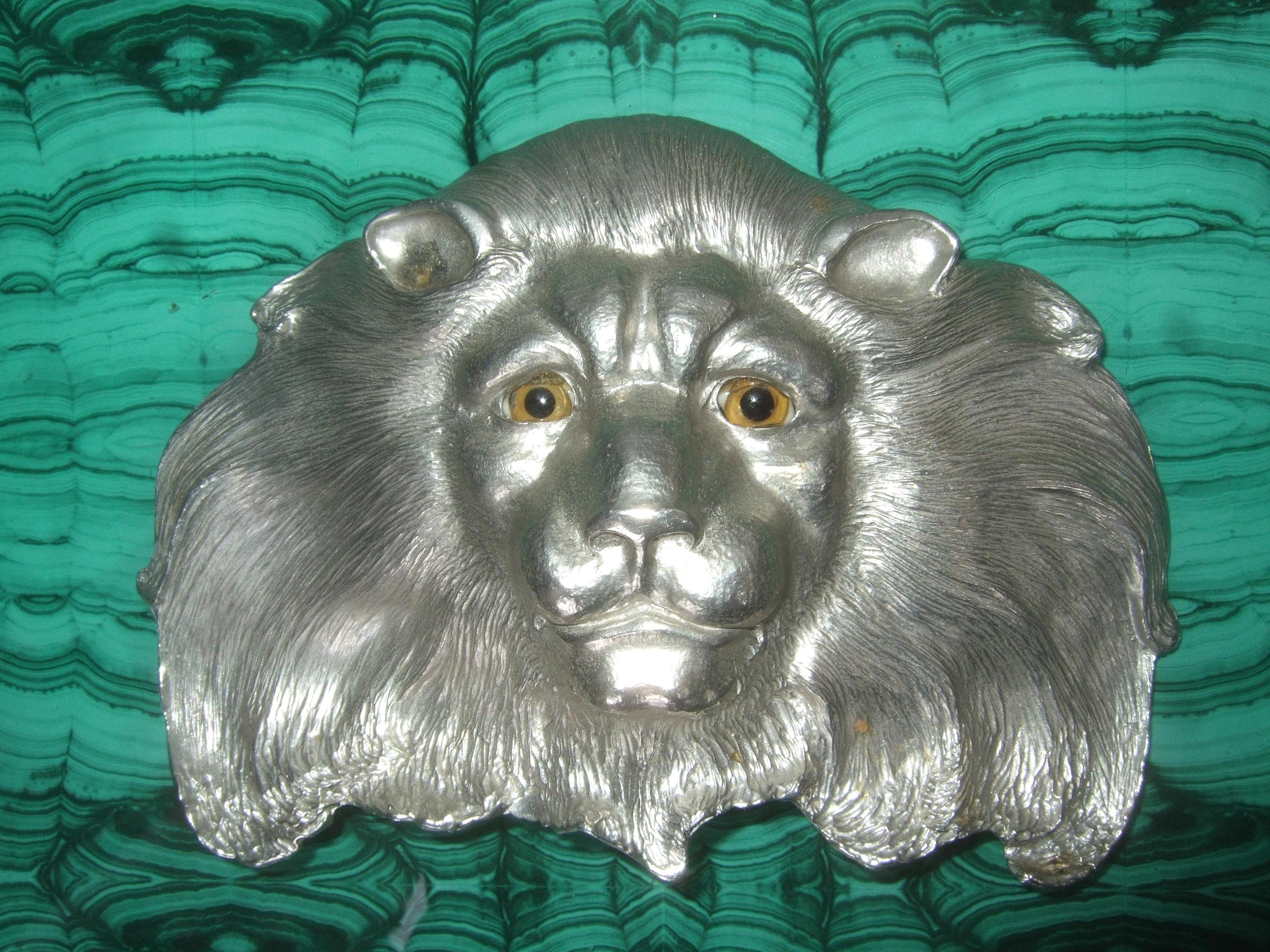 Christopher Ross Massive huge scale artisan silver matte metal lion belt buckle c 1984
The dramatic enormous size belt buckle is designed with a stylized lion's face
The sinuous impressed etched detail emulates the lion's mane 

Adorned with a pair