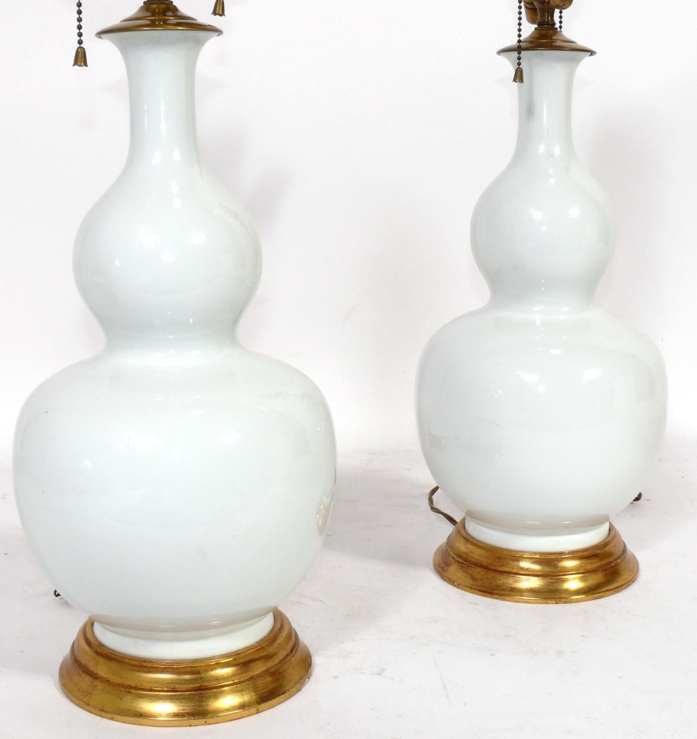 Pair of Elegant Double Gourd Aurora Lamps by Christopher Spitzmiller, New York City, New York, American, circa 2000s. Signed with Spitzmiller label to one lamp, see last photo. They are constructed of hand thrown ceramic vessels with 23 karat gilt