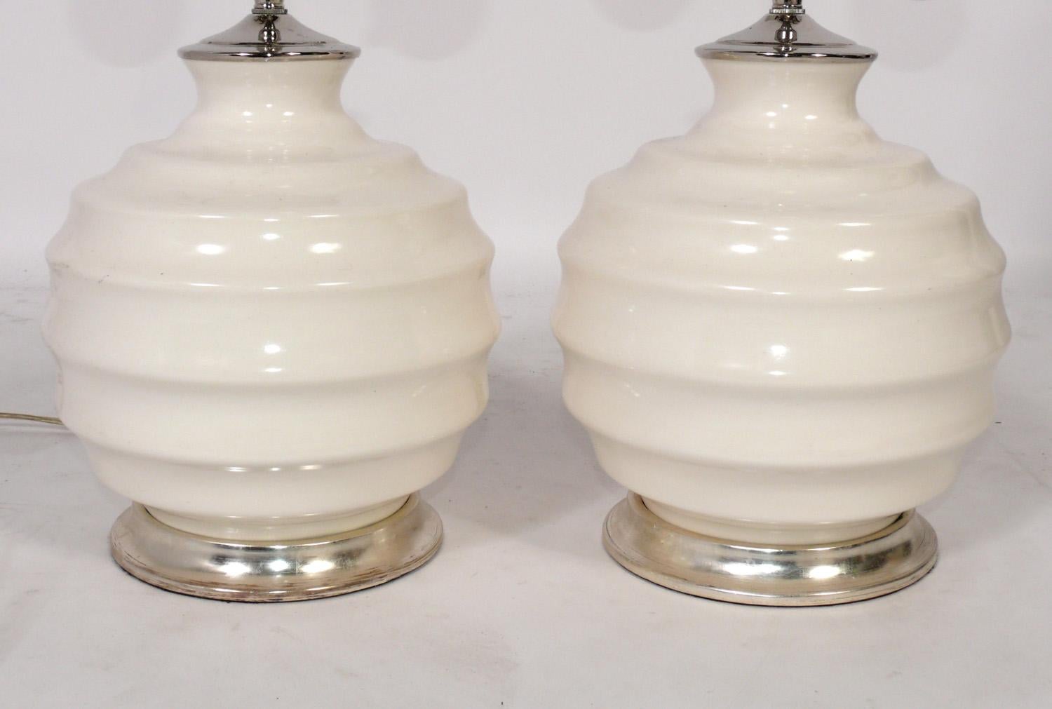 Pair of Petite Hand Thrown Ceramic Ribbed Ball Lamps in White Glaze, by Christopher Spitzmiller, New York City, New York, American, circa 2000s. Signed with Spitzmiller label to one lamp, see last photo. These were recently removed from the famous