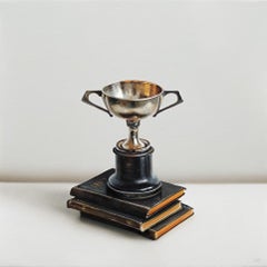 Trophée et trois livres anciens