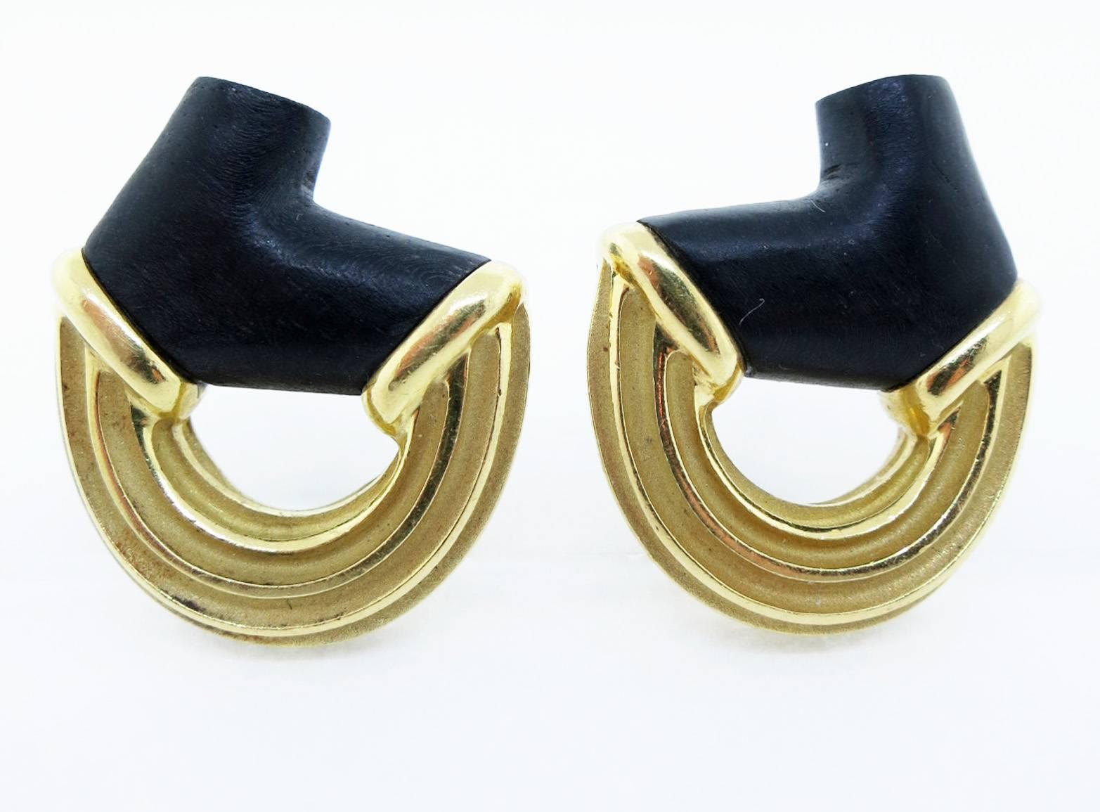 Stunning contemporary opposing design  18kt. earrings made by Christopher Walling. Each earring is a combination of matte and high finish 18kt. yellow gold with a matte finish organic form onyx. Clip back posts can be added. Original box included.