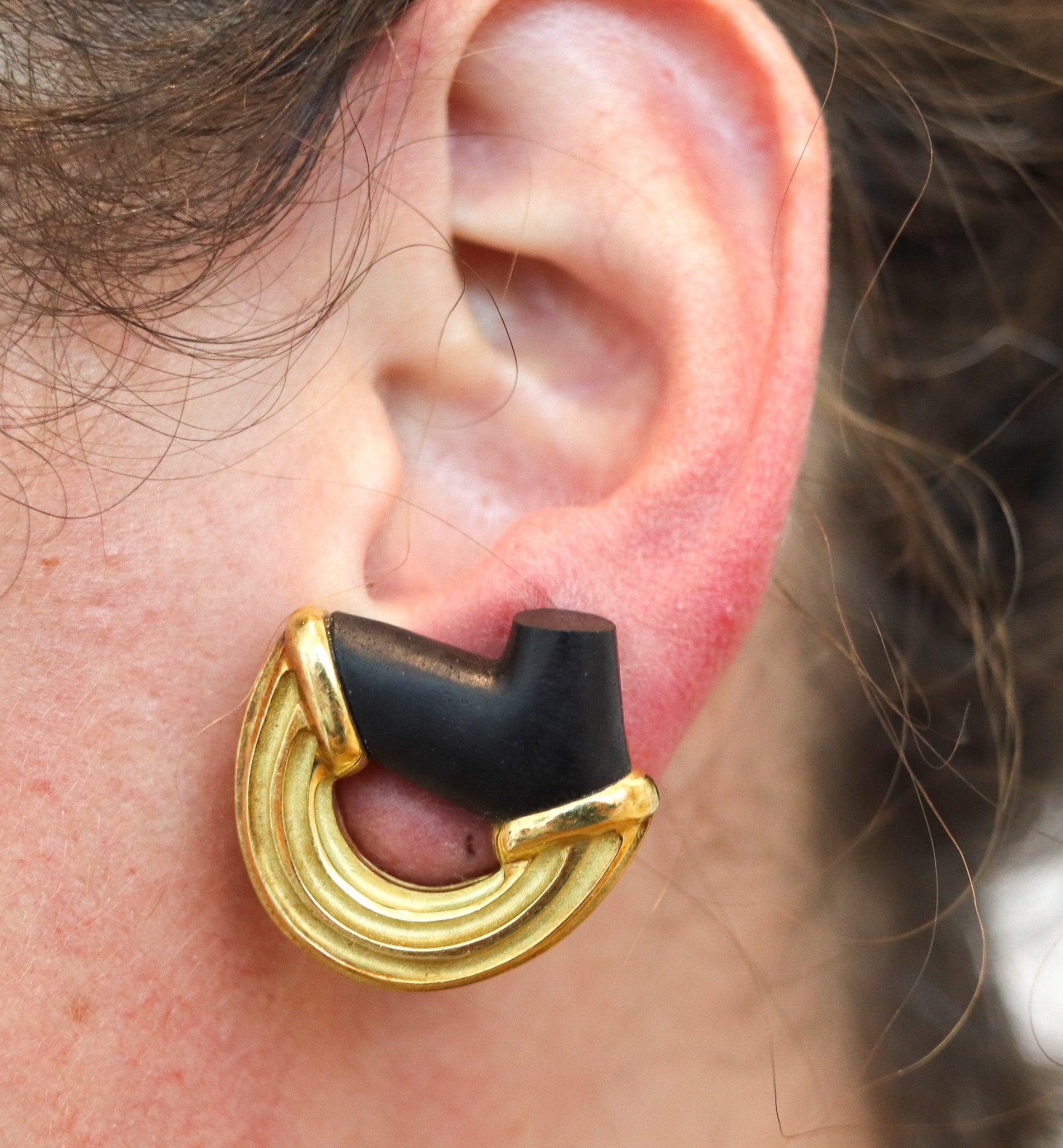 Pair of clips-on earrings designed by Christopher Walling.    

This is a beautiful pair of clips-on earrings, created by the jewelry designer Christopher Walling, back in the late 1970. The earrings has been crafted as a left and ring, with organic