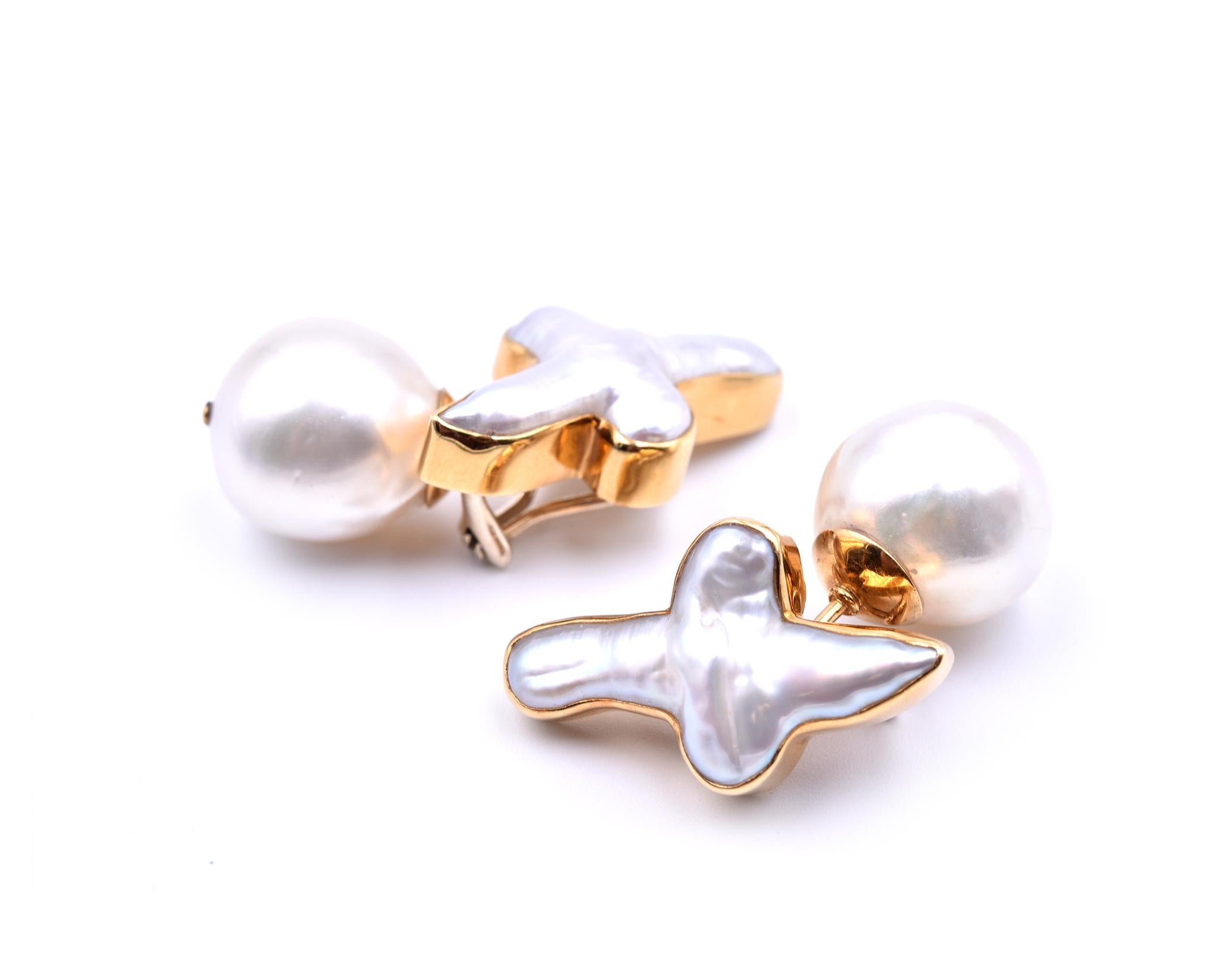 Designer: custom design
Material: 18k yellow gold
Pearls: semi round 15.2mm diameter
Fastenings: omega clips
Dimensions: each earring is 1 1/2-inch long and 1/2-inch wide 
Weight: 22.53 grams
