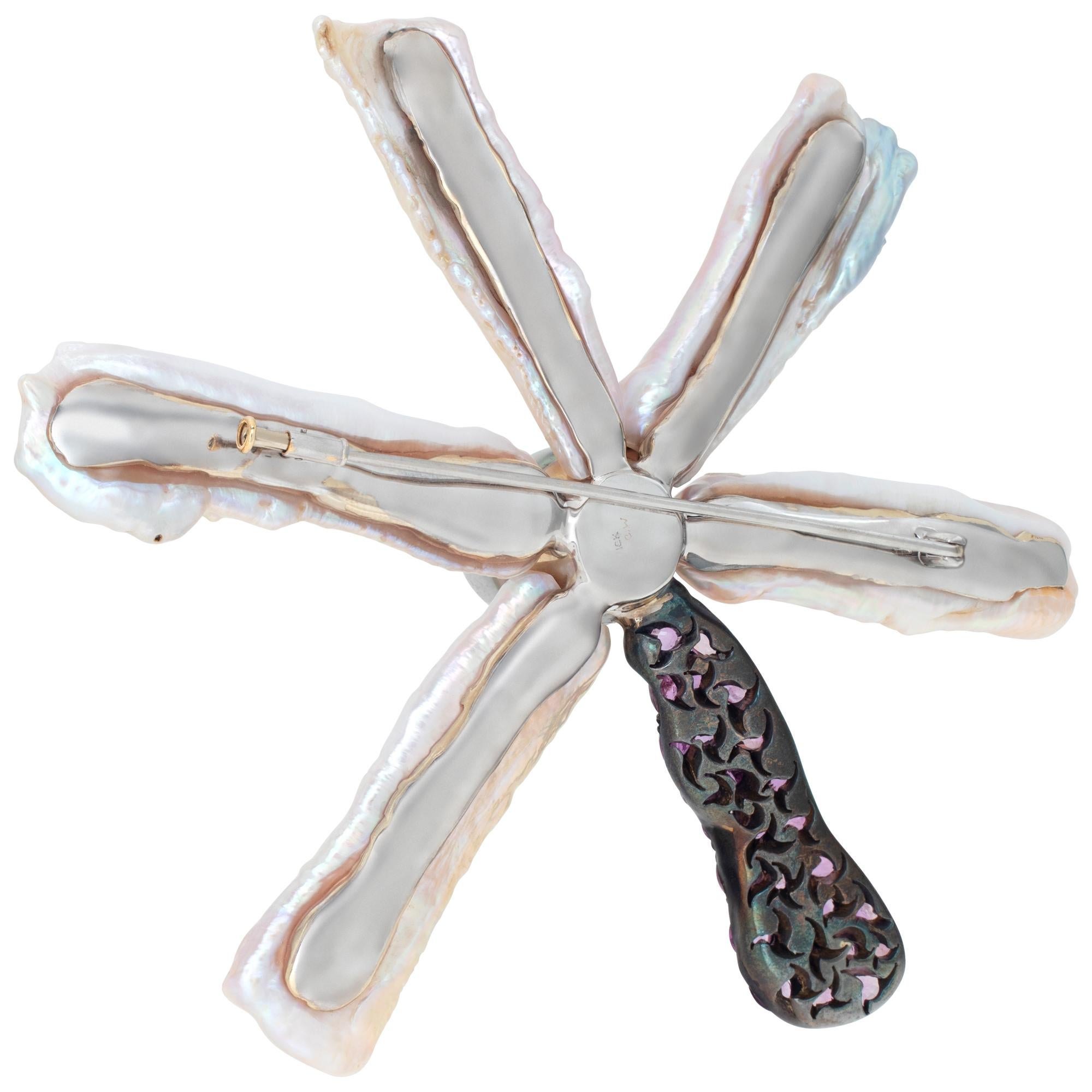 Christopher Walling multi-gem flower brooch in 18k white gold. Contains five cultured biwa pearl petals, 25 oval mixed cut pink sapphires and a center 16.5 mm black Tahitian pearl. Brooch is 4.25 inches in diameter. Can be converted to a pendant to