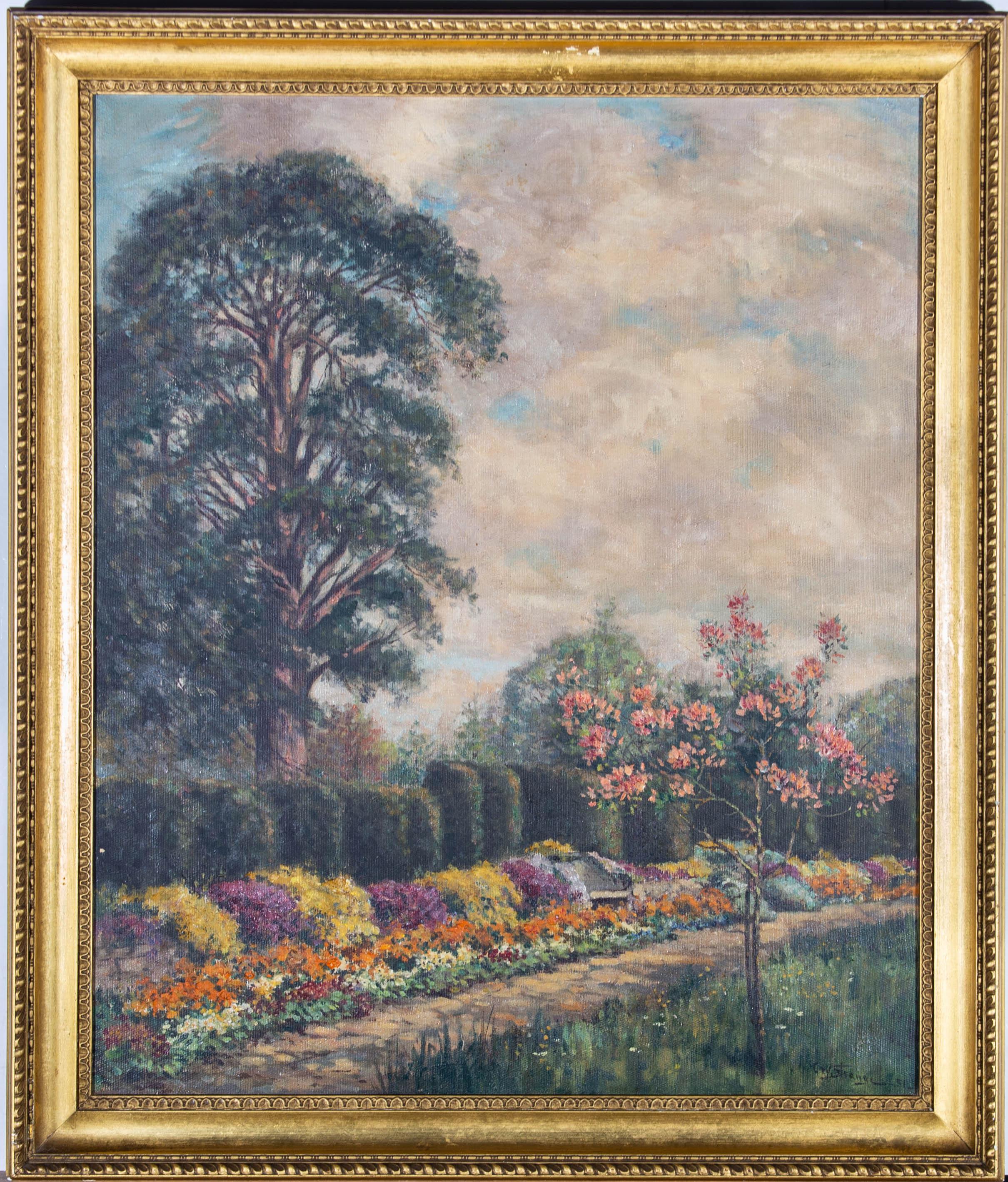 A beautiful early 20th Century garden scene in oil showing a garden the height of Spring. The artist has signed and dated to the lower right and the painting has been presented in a gilt frame with lozenge molding. On canvas .
