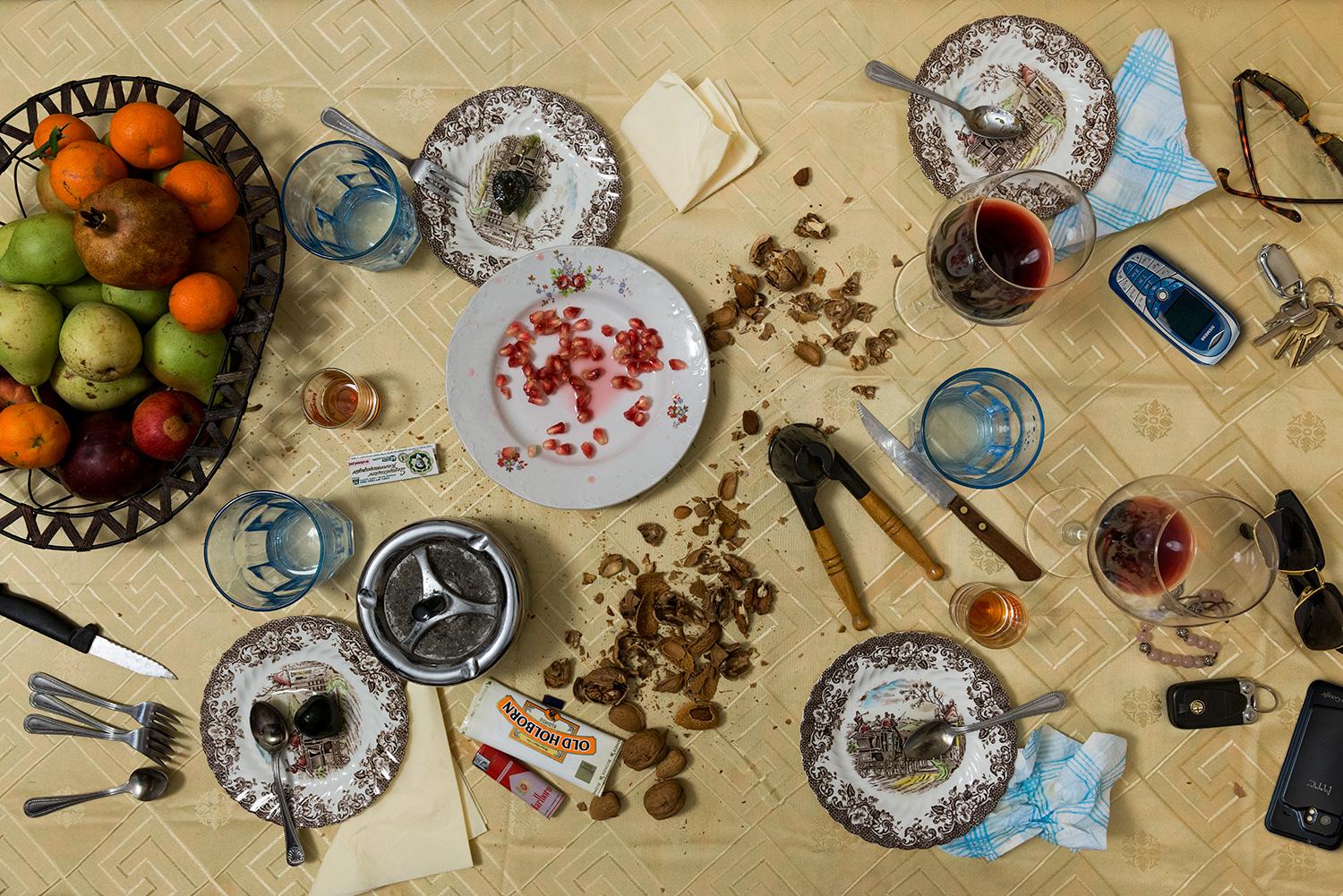 This photograph belongs to the series "Conversations." Evoking Dutch still-life as inspiration, these beautiful, contemporary tabletops contemplate technology's implications upon human interaction and memory. Shared meals with friends and family