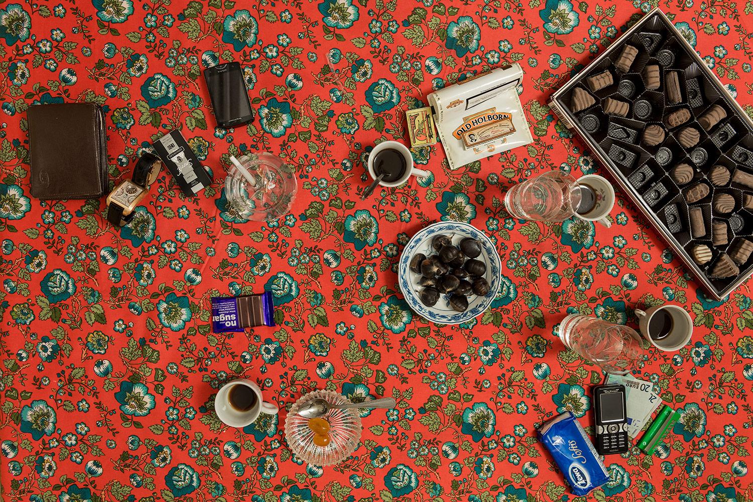 This photograph belongs to the series "Conversations." Evoking Dutch still-life as inspiration, these beautiful, contemporary tabletops contemplate technology's implications upon human interaction and memory. Shared meals with friends and family