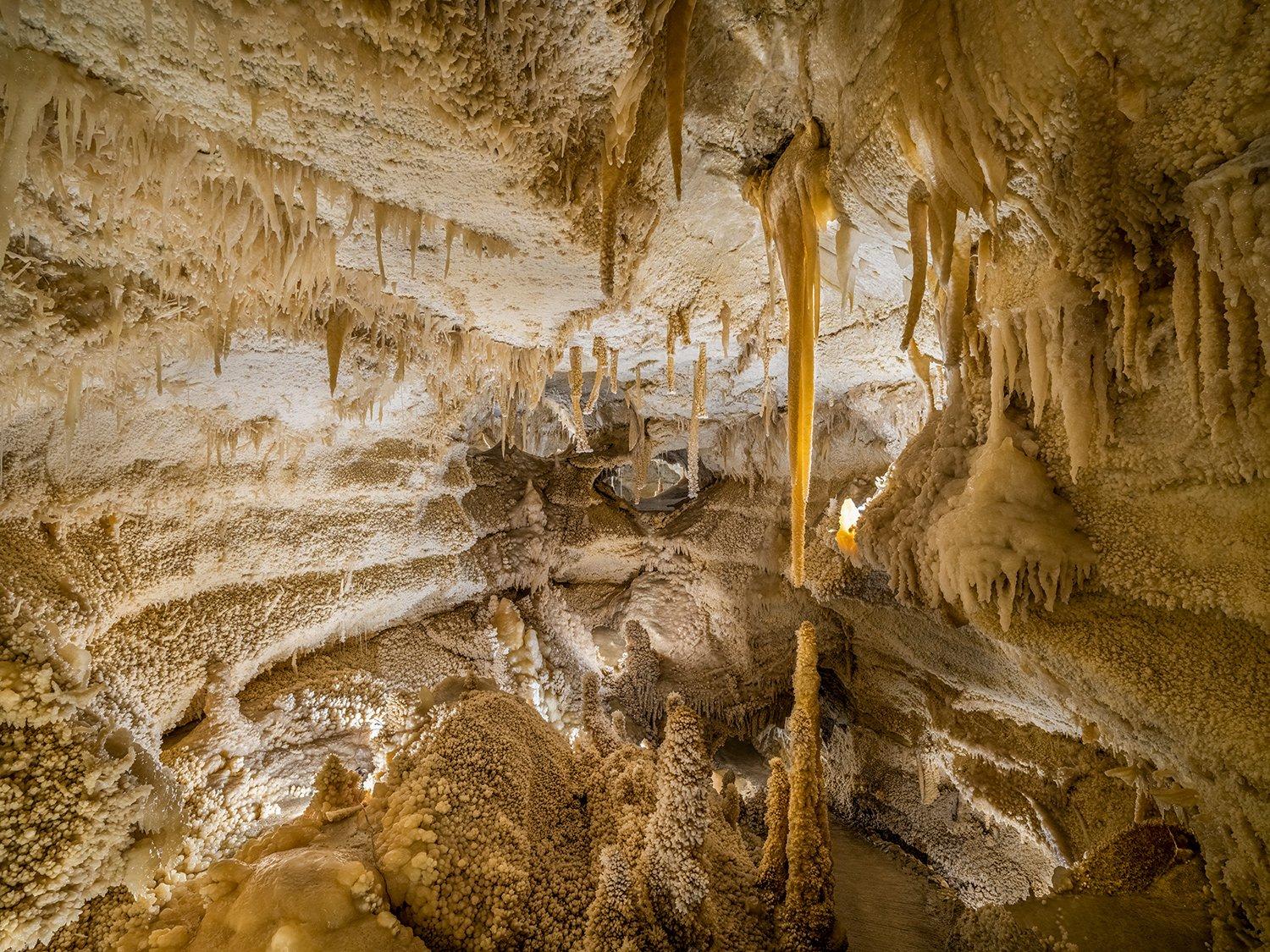 "RESPLENDENCE OF ANTIPODES
In the scope of civilization, the subterranean realm remains largely unchanged. Isolated in darkness for hundreds of millions of years, the sunless underworld encompasses majestic ancient formations gradually eroded into