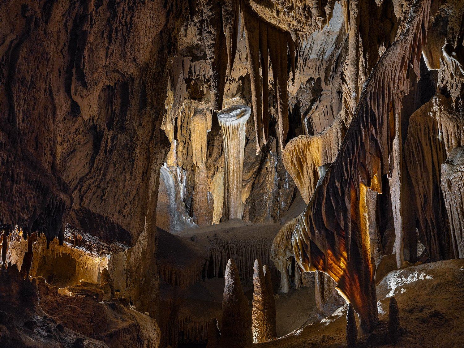 "RESPLENDENCE OF ANTIPODES
In the scope of civilization, the subterranean realm remains largely unchanged. Isolated in darkness for hundreds of millions of years, the sunless underworld encompasses majestic ancient formations gradually eroded into