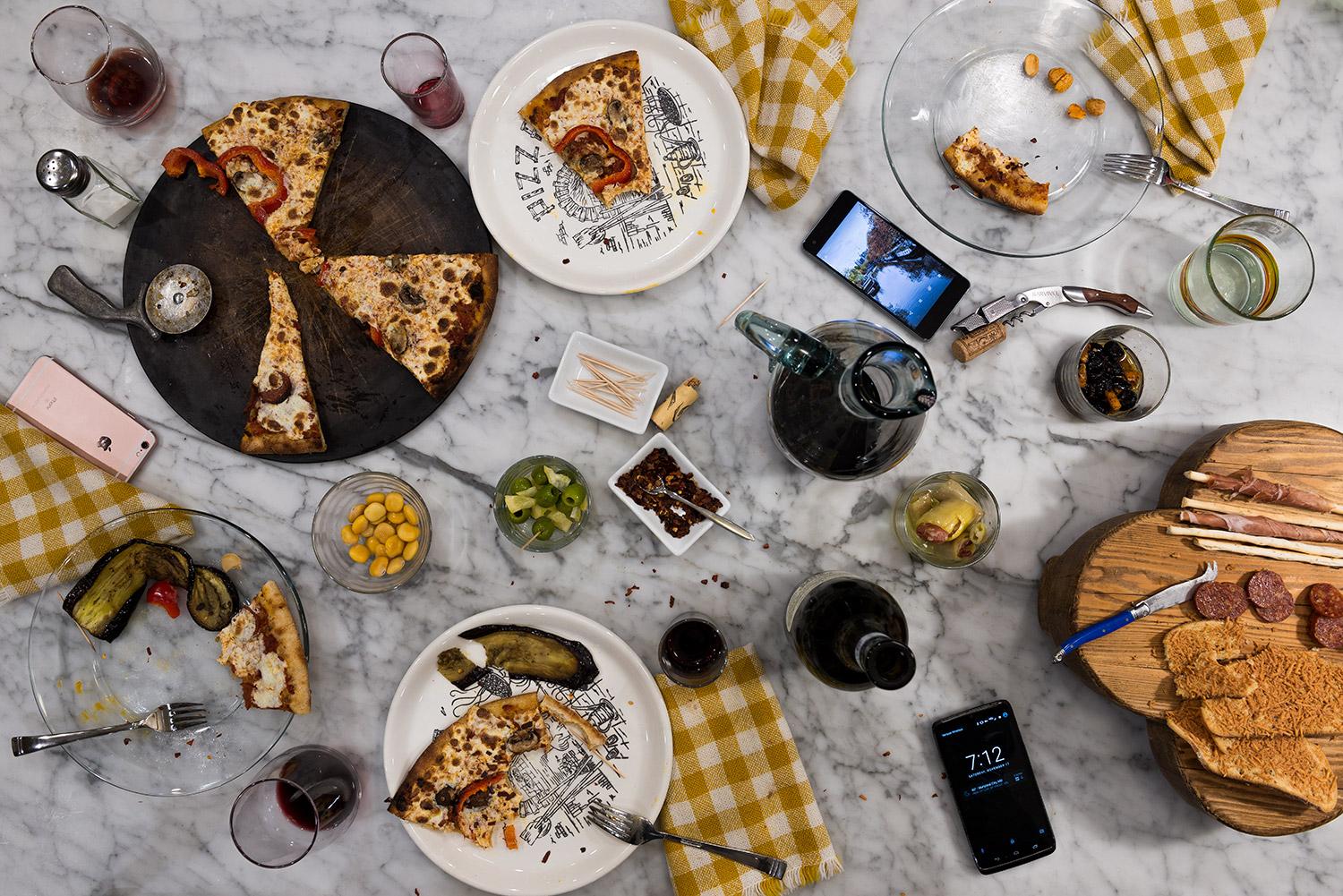 This photograph belongs to the series "Conversations." Evoking Dutch still-life as inspiration, these beautiful, contemporary tabletops contemplate technology's implications upon human interaction and memory. Shared meals with friends and family