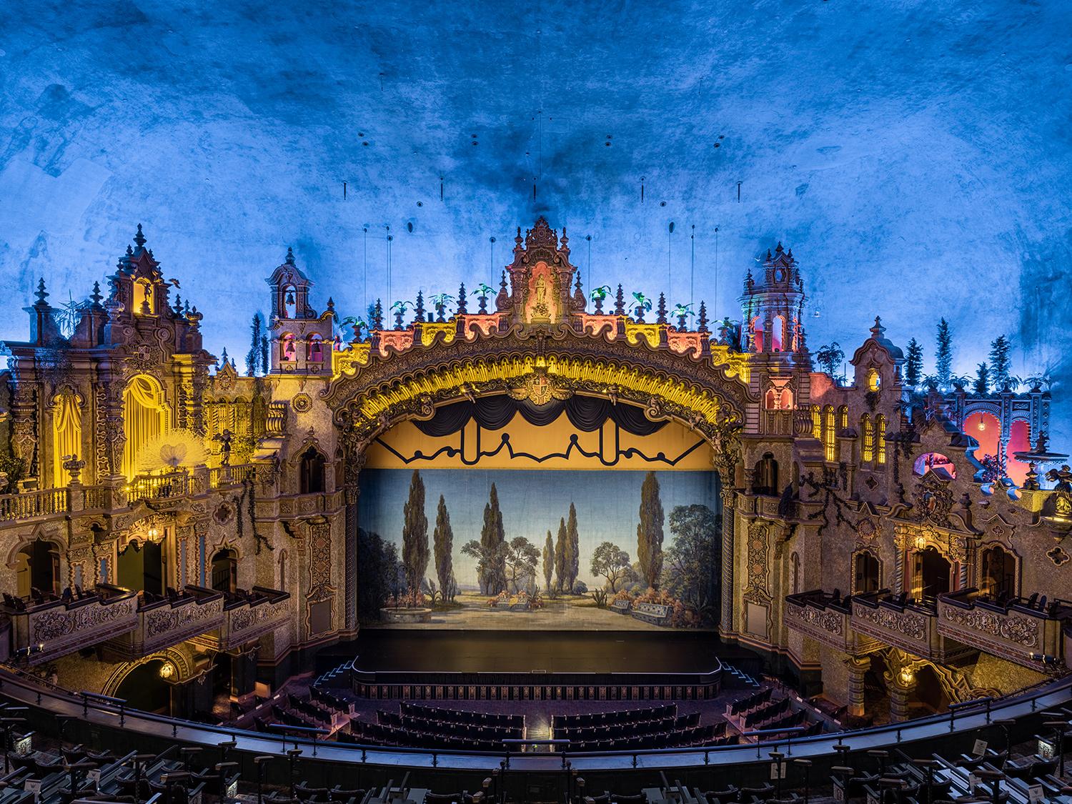 One of the last pure Art Deco picture-palaces and concert halls in the nation. The beautiful Fountain of Light in glowing emerald sapphire glass against a butterscotch topaz sits over the wide entrance in a four-story grand lobby. This large