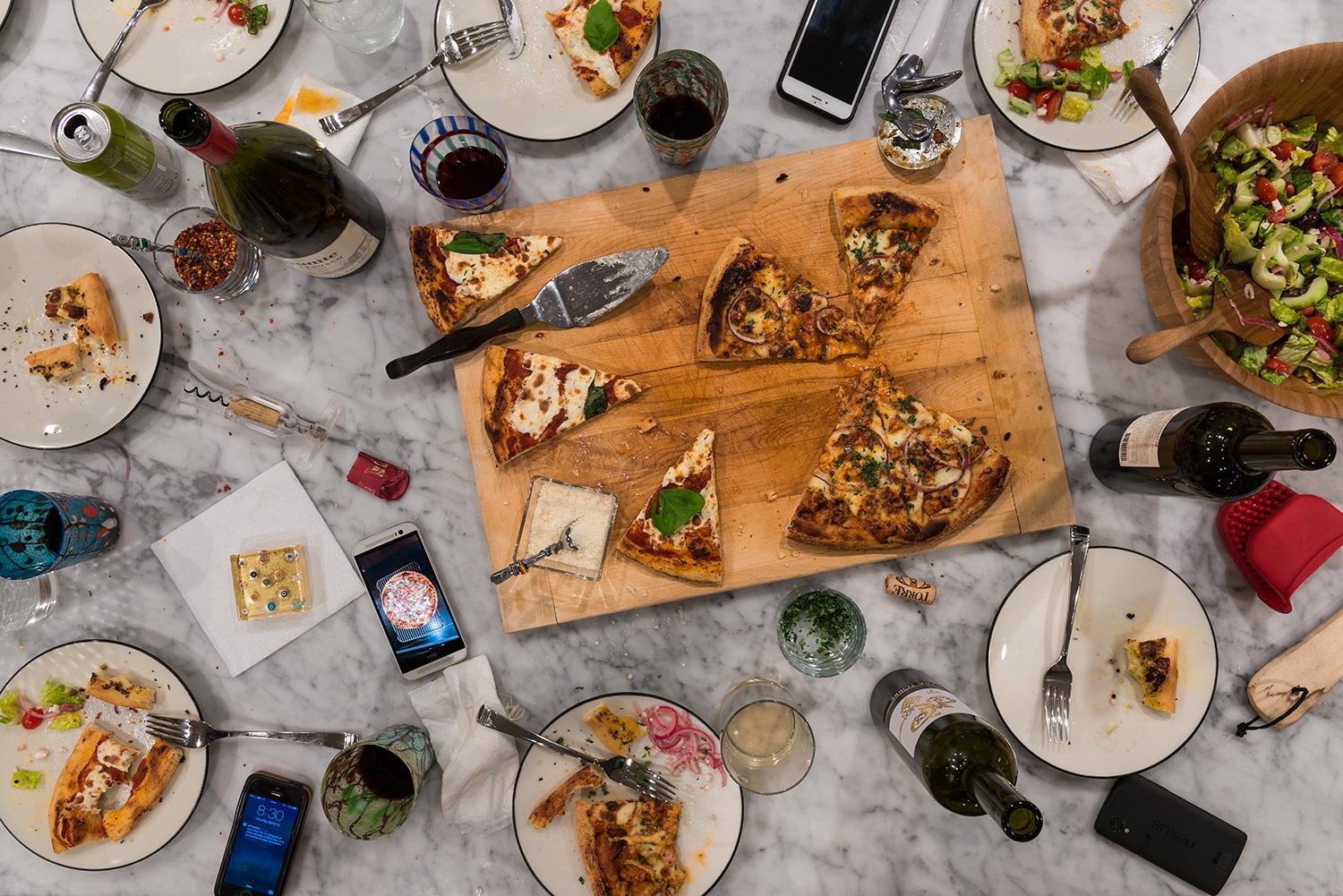 This photograph belongs to the series "Conversations." Evoking Dutch still-life as inspiration, these beautiful, contemporary tabletops contemplate technology's implications upon human interaction and memory. Shared meals with friends and family
