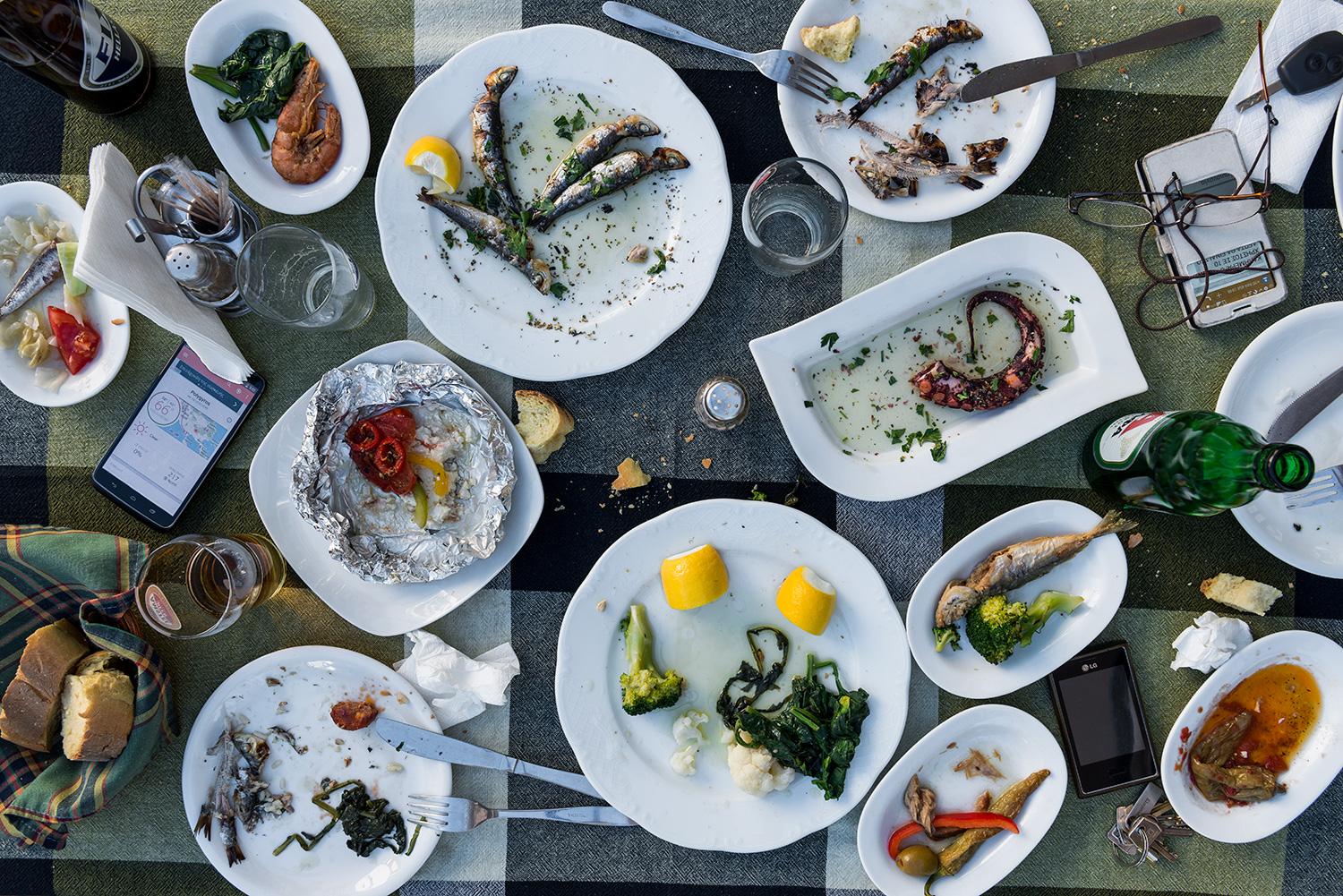 This photograph belongs to the series "Conversations." Evoking Dutch still-life as inspiration, these beautiful, contemporary tabletops contemplate technology's implications upon human interaction and memory. Shared meals with friends and family