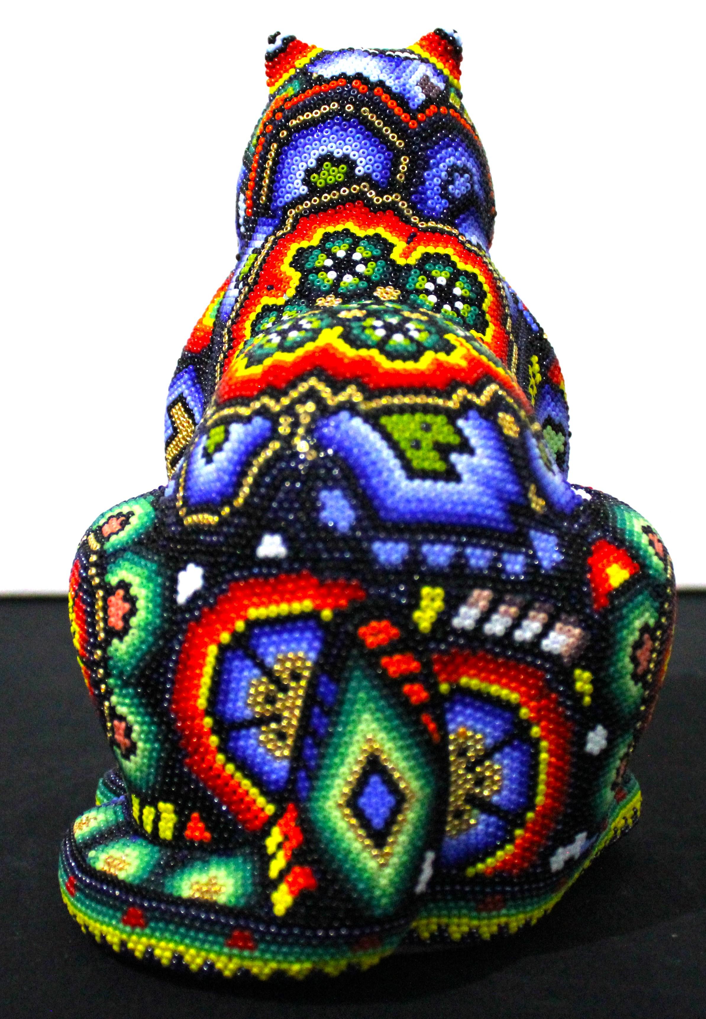 Bull Sculpture in Mexican Huichol Style 

AP. 0007 

ALTERATION ART . . . is a collaboration process between Rick Wolfryd, fine artist and art dealer with over 40 years experience, and various Mexican Huichol artists and Mexican Huichol art studios