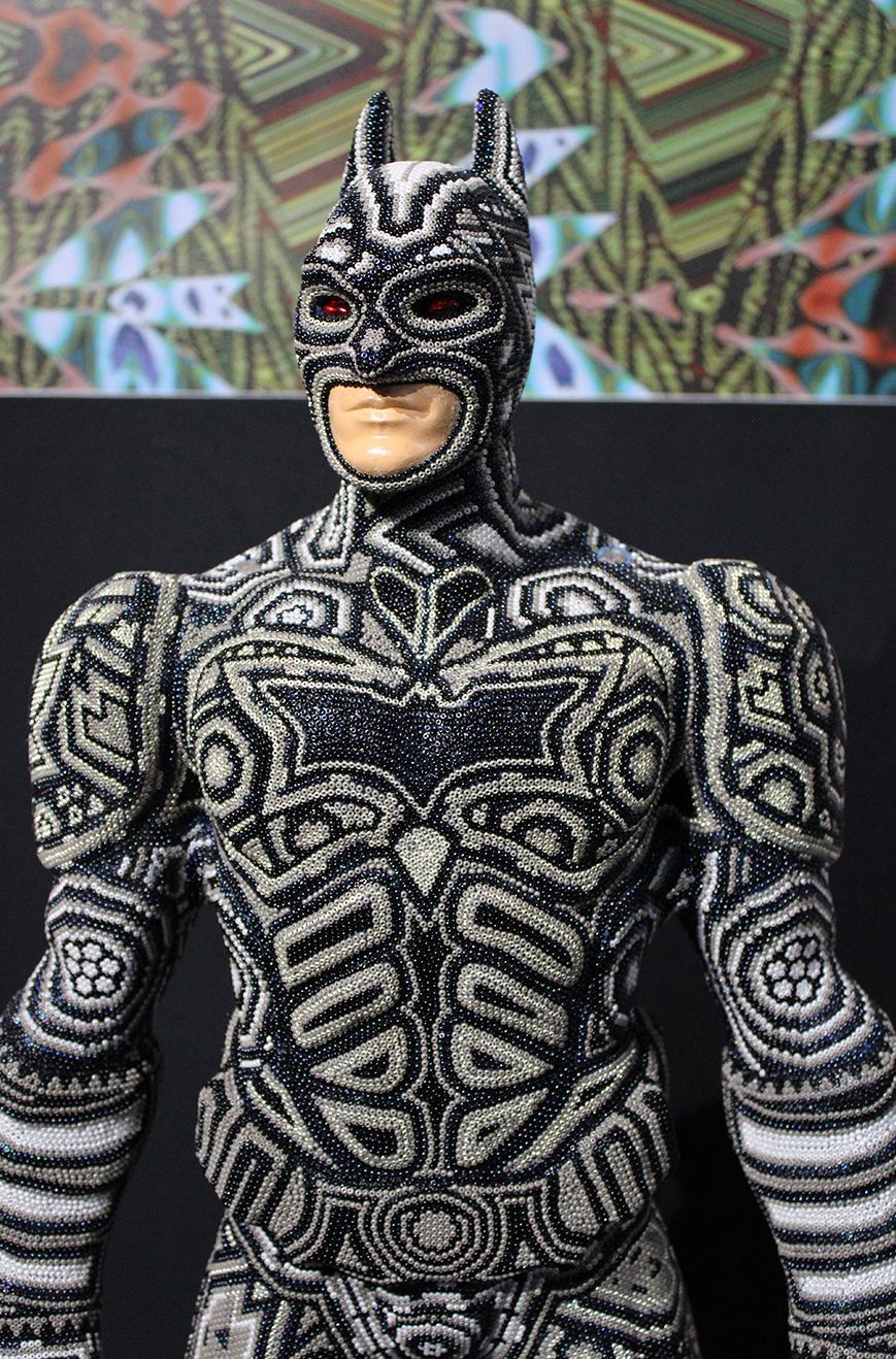 Batman in an unusual way. Full of color and complex patterns.

ALTERTATION ART . . . is a collaboration process between Rick Wolfryd, fine artist and art dealer with over 40 years experience, and various Mexican Huichol artists and Mexican Huichol