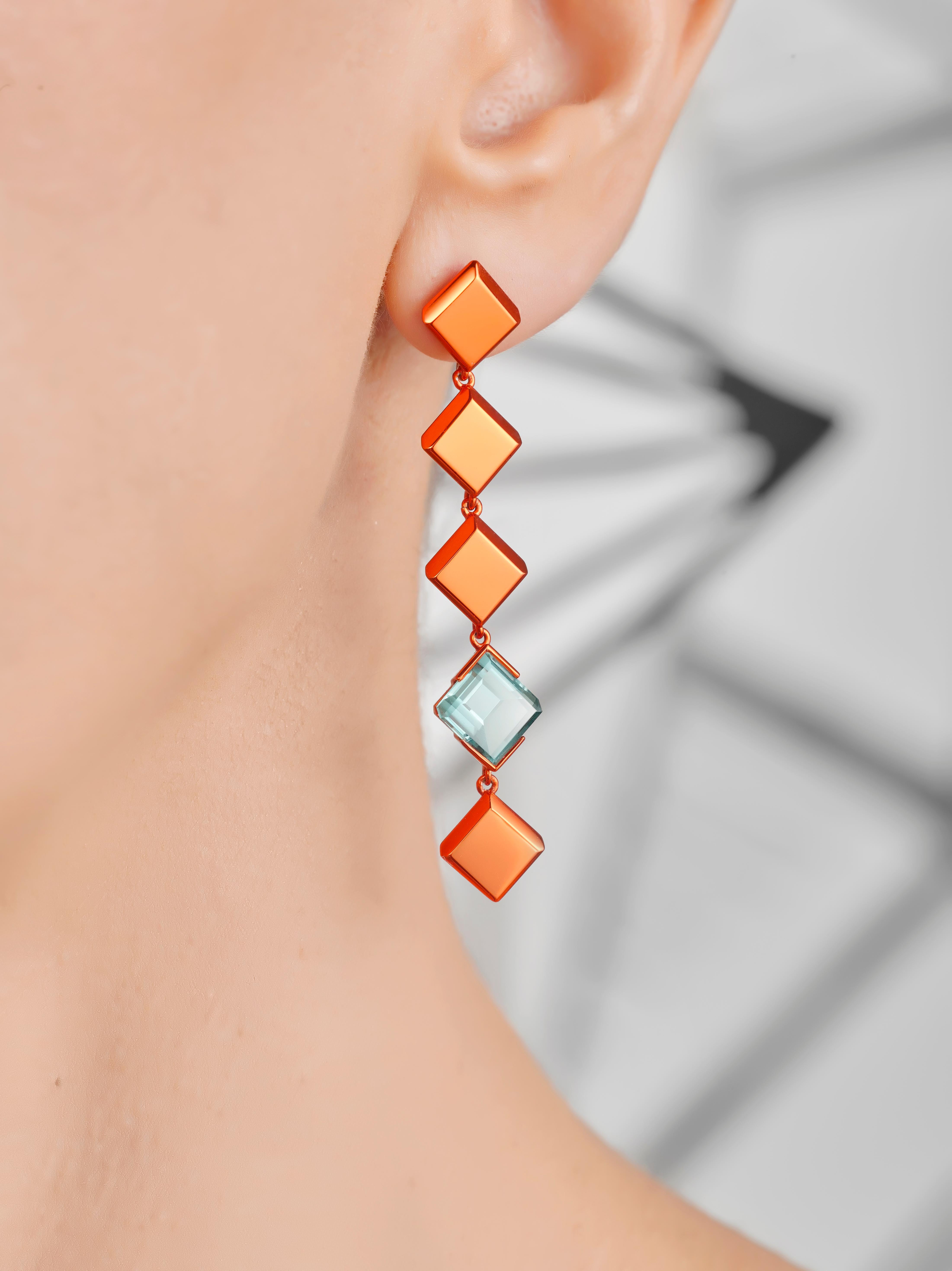 Measurements
Earring Length 56mm  
Diameter 11mm
Pair weighs approximately 10.5g 

The Rock Hound's Chromanteq Nigerian Mandarin Garnet 2.82cts and Namibian Tourmaline 2.12cts asymmetrical earrings set in
18 Carat Recycled White Gold coated with our