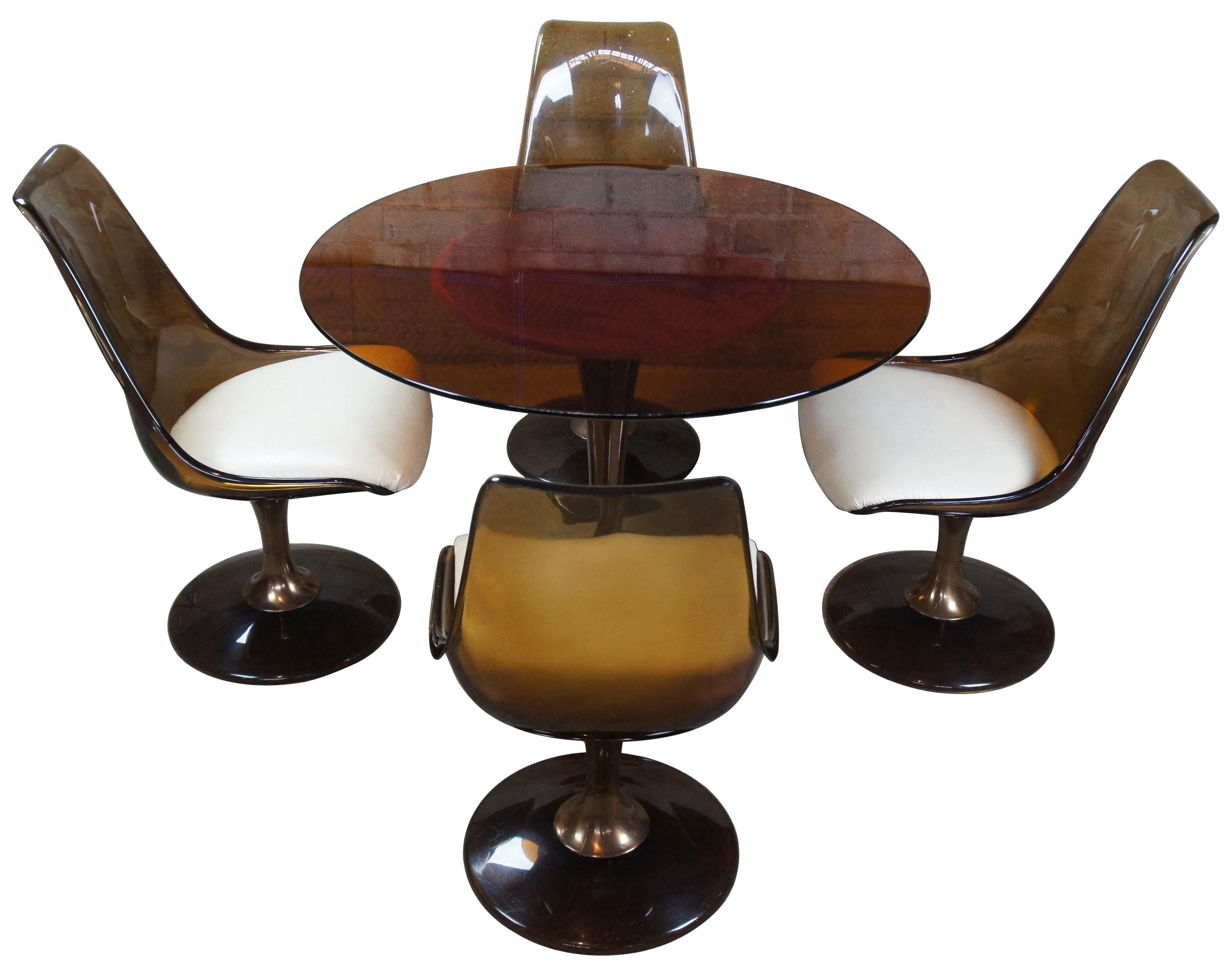 Chromcraft Saarinen smoked Lucite table set, circa 1970s. Features four tulip chairs and amber colored glass top.

Dimensions: Chairs 20