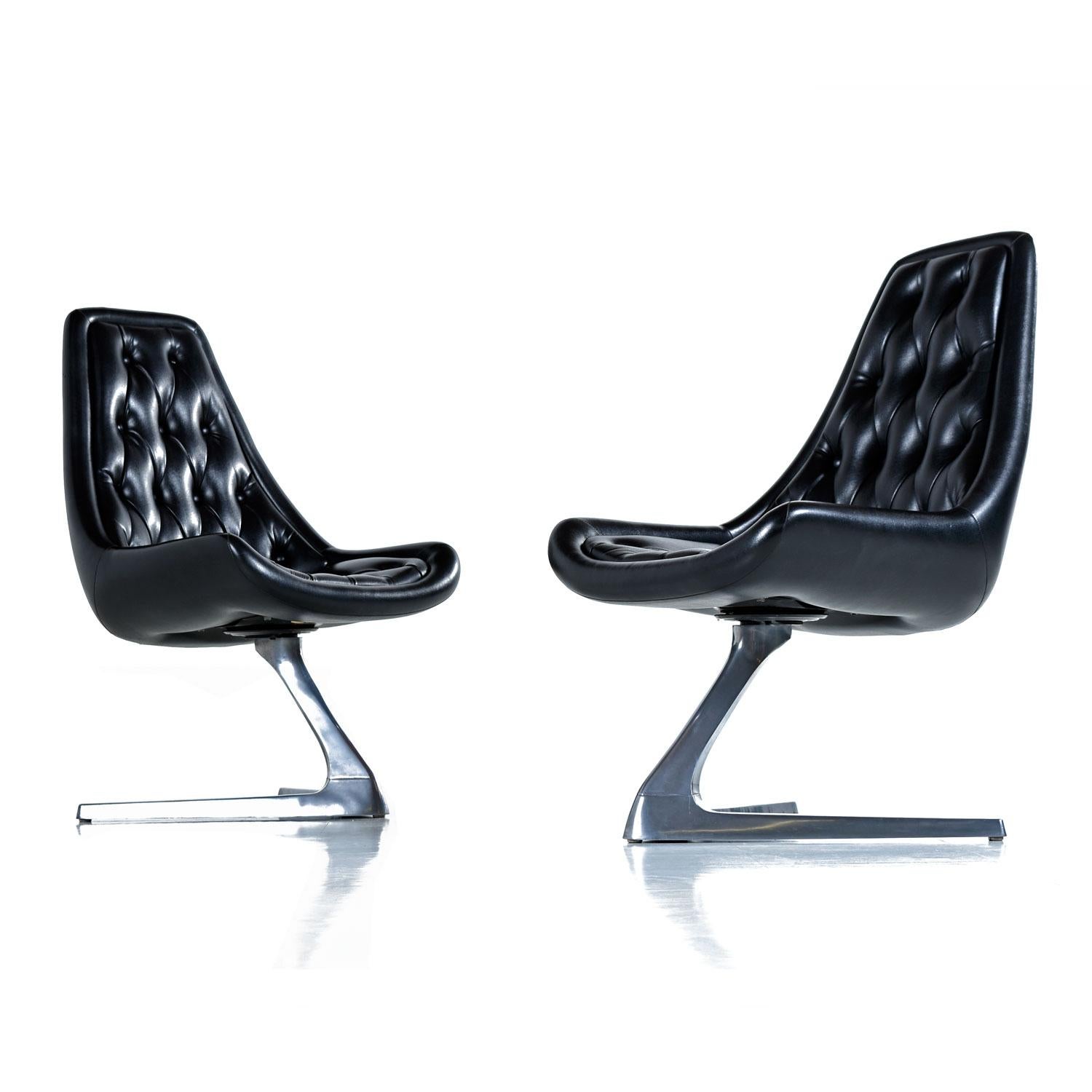 These Chromcraft Sculpta chairs AKA Unicorn chairs were designed in the style of Vladimir Kagan. The futuristic design, stamped 1968, was featured on Star Trek. This set of four are all outfitted in their original, durable, black vinyl upholstery.