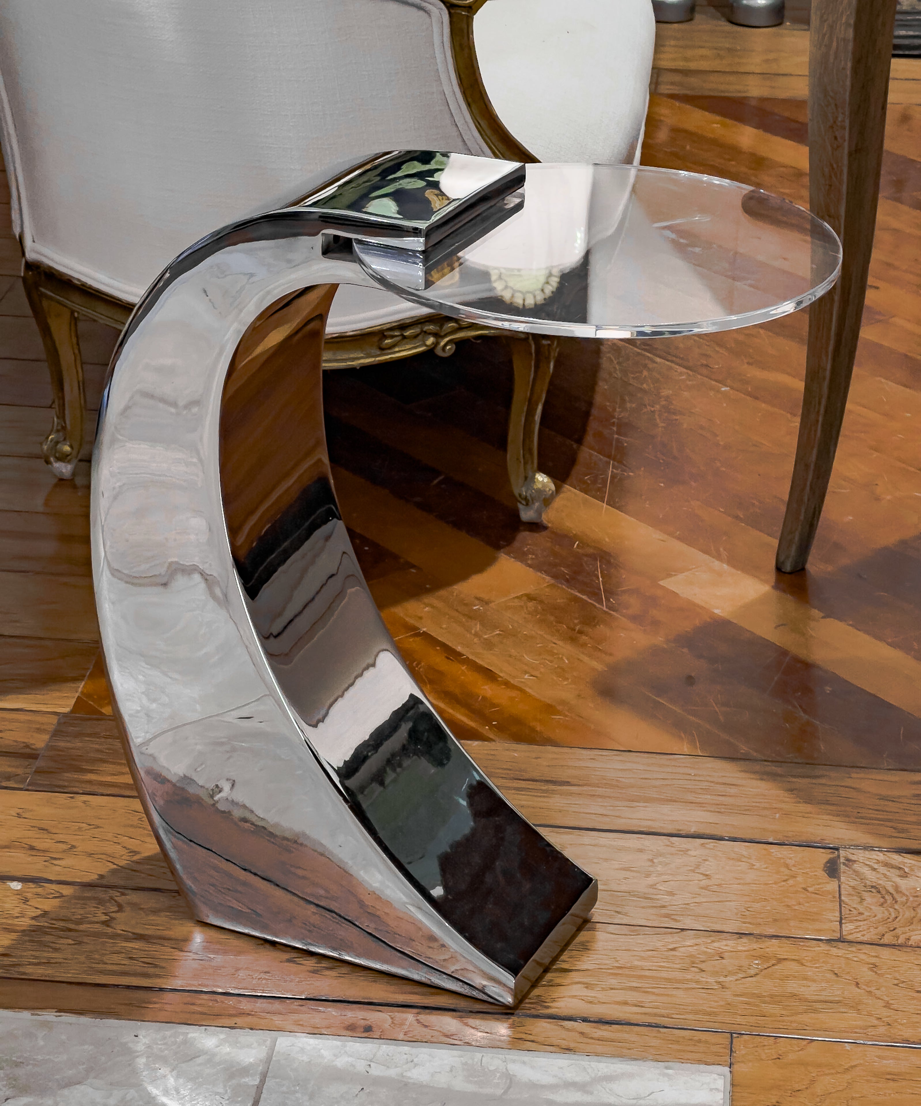 Mid-Century Modern from around the 1960's. Timeless and graceful contemporary design in chrome & acrylic sure to compliment any elegantly furnished home. 

Try adding this great modern side table to add a punch to any decor! The bright chrome base